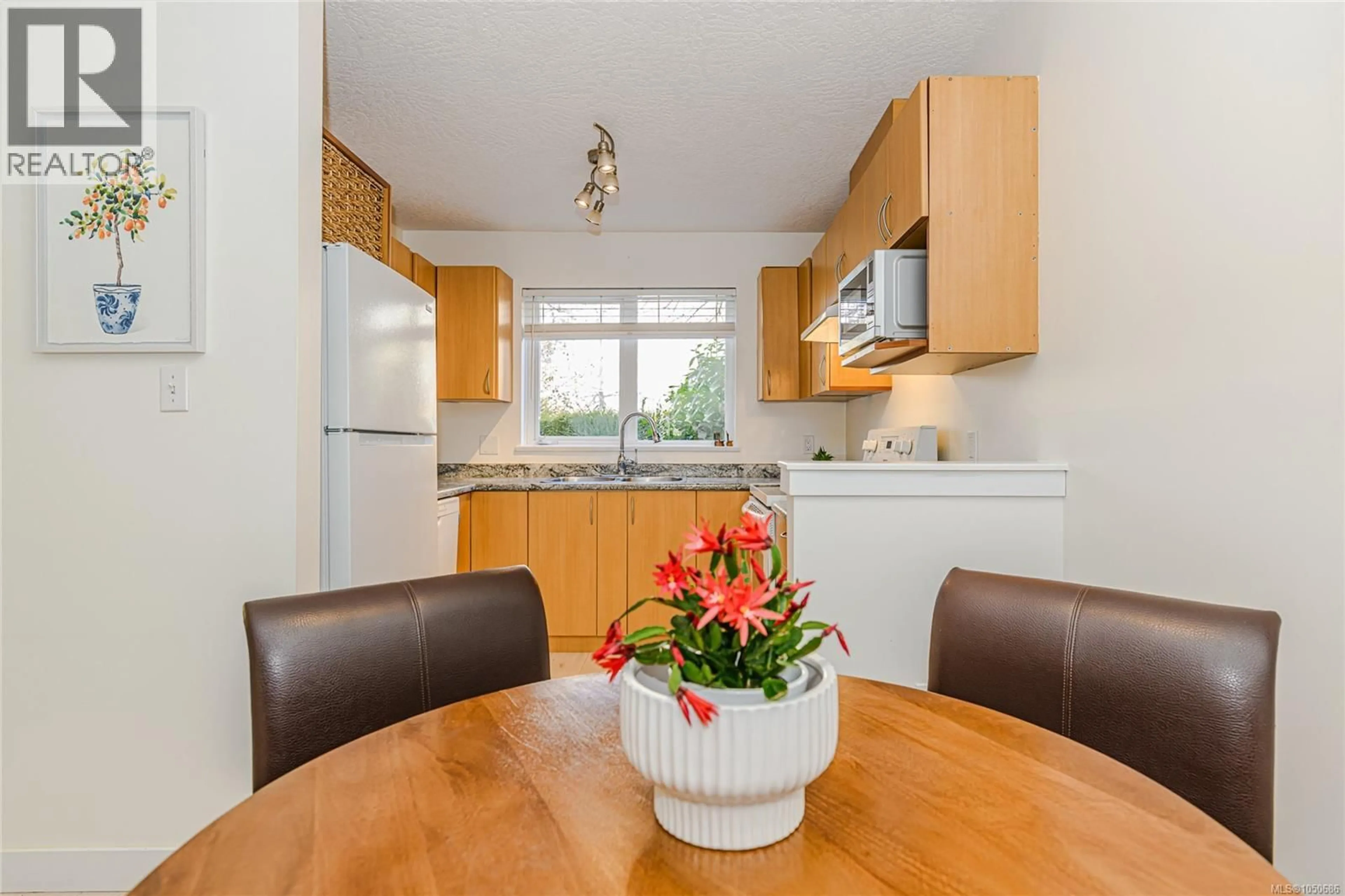 Standard kitchen, wood/laminate floor for 103 - 3180 ALBINA STREET, Saanich British Columbia V9A1Z5