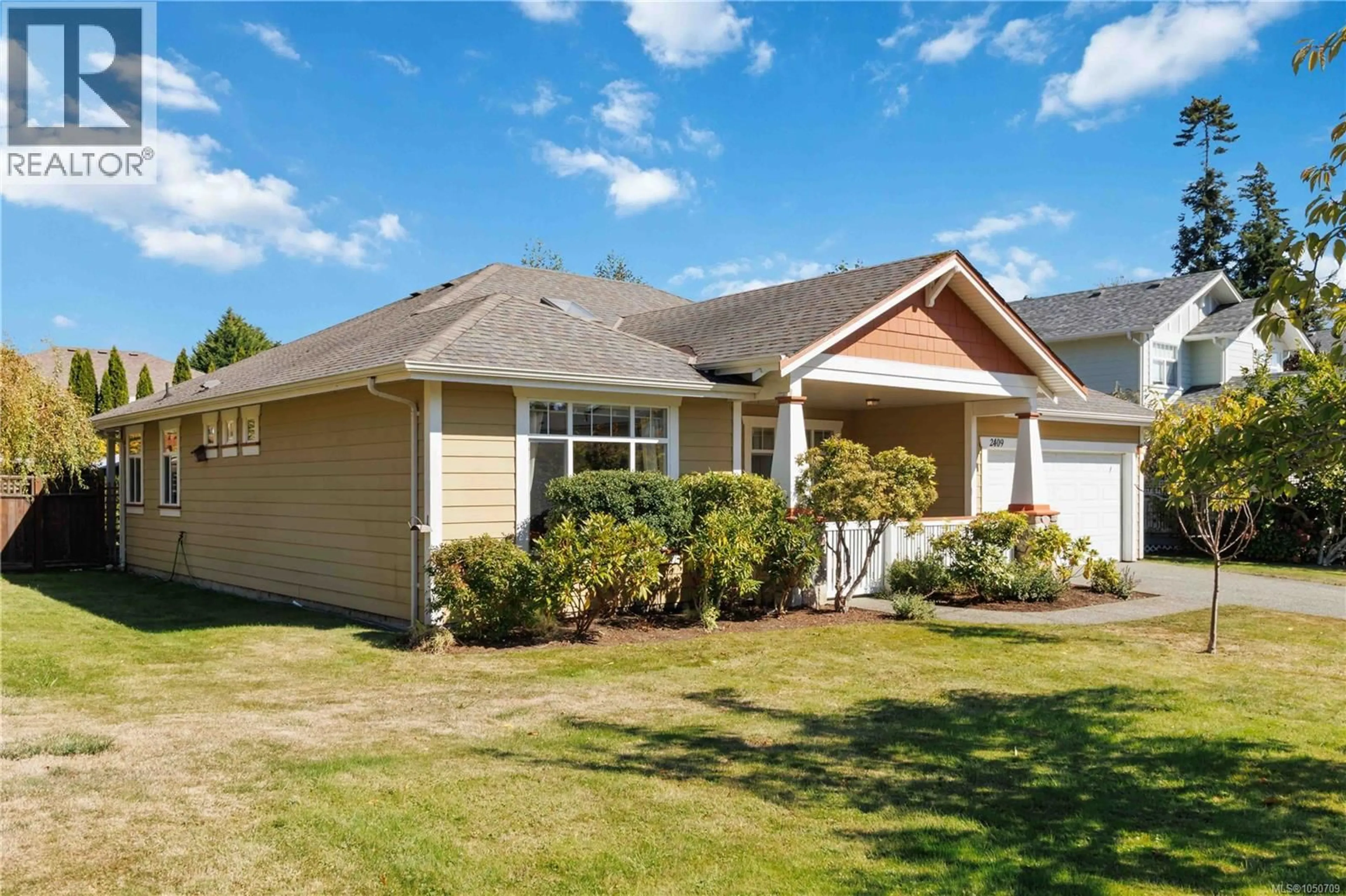 Home with vinyl exterior material, street for 2409 POPLAR DRIVE, Sooke British Columbia V9Z0Y5