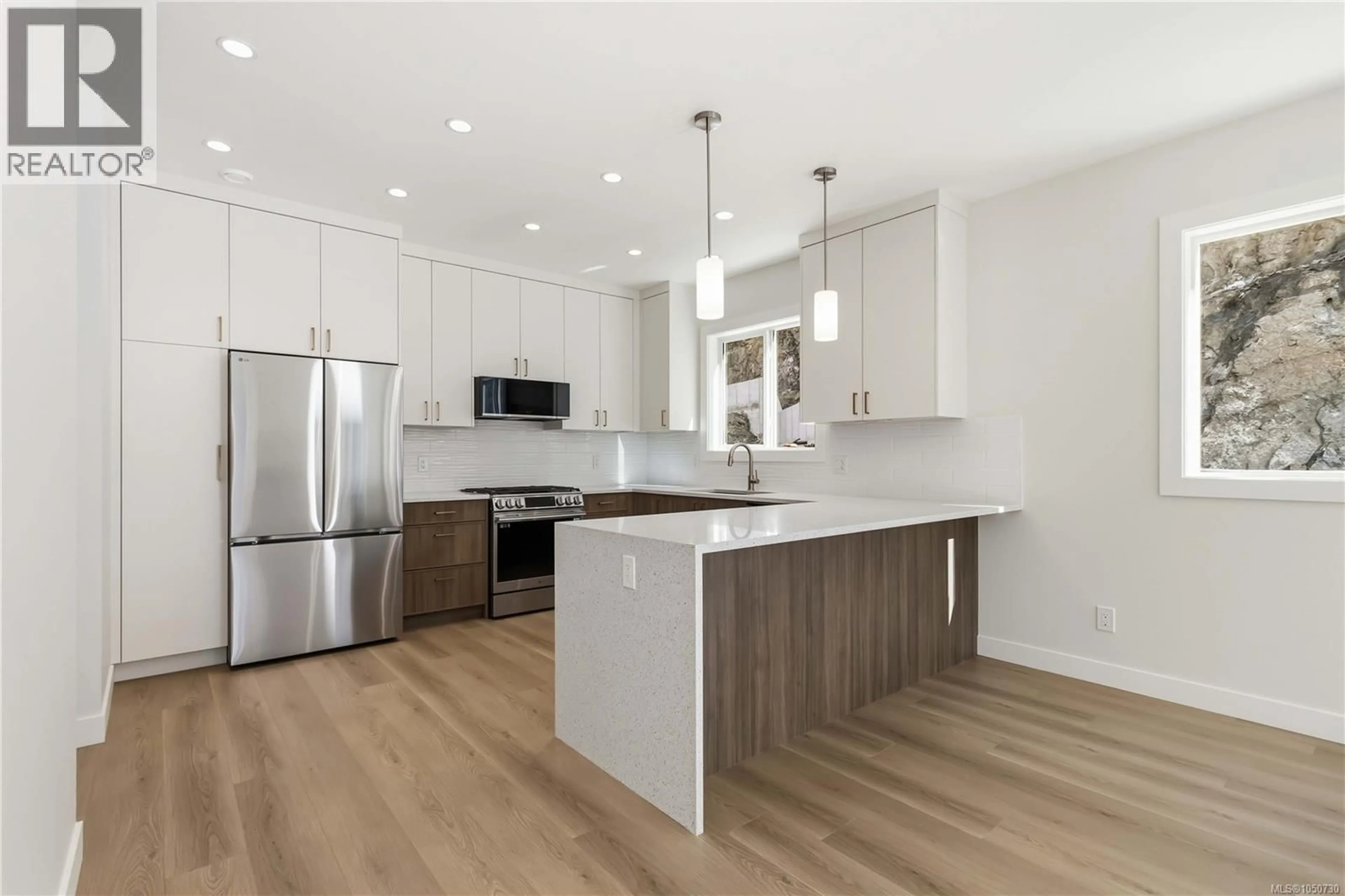 Open concept kitchen, wood/laminate floor for 3475 MERLOT TERRACE, Langford British Columbia V9C0N6
