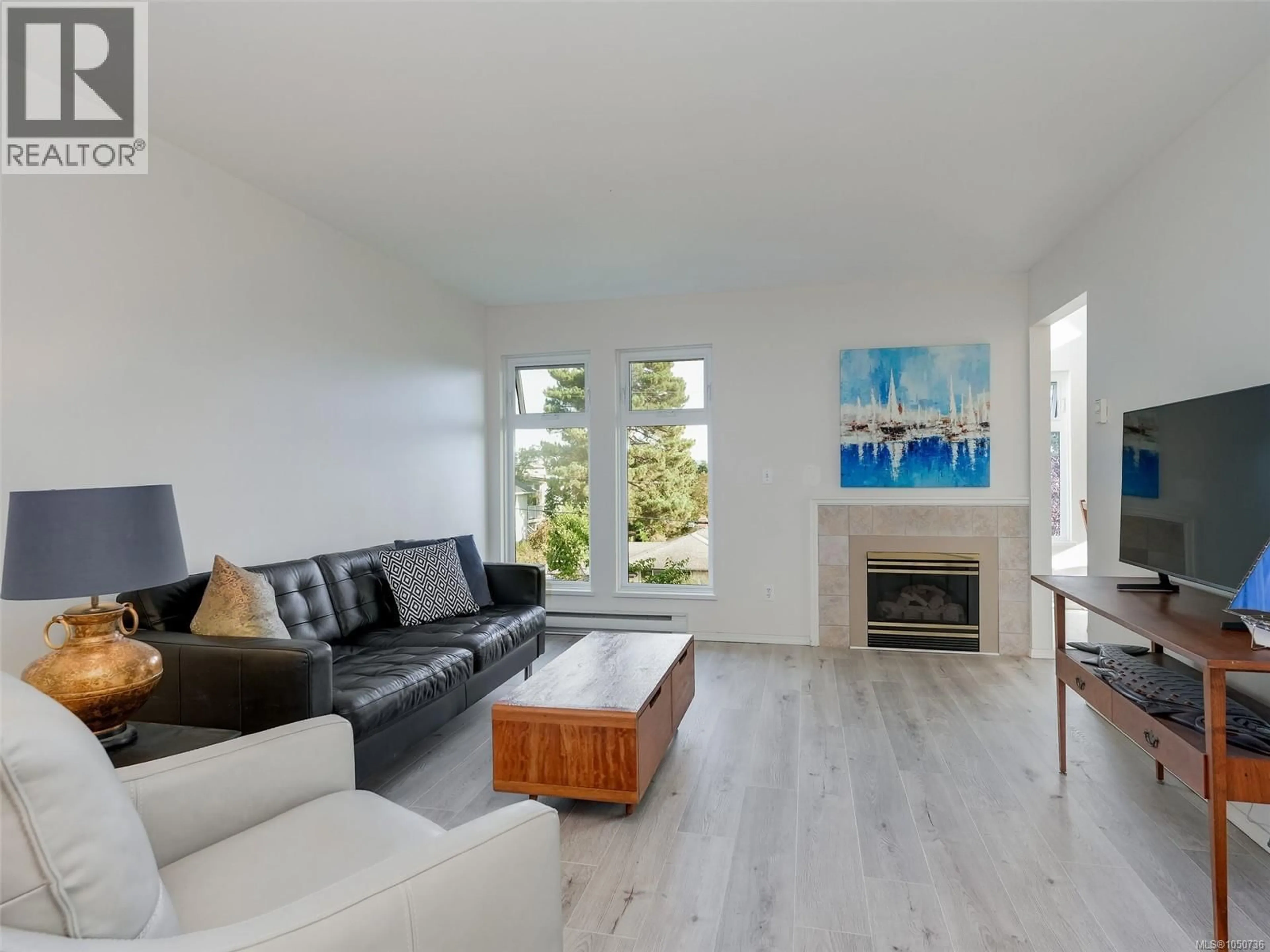 Living room with furniture, wood/laminate floor for 301 - 837 SELKIRK AVENUE, Esquimalt British Columbia V9A2T7