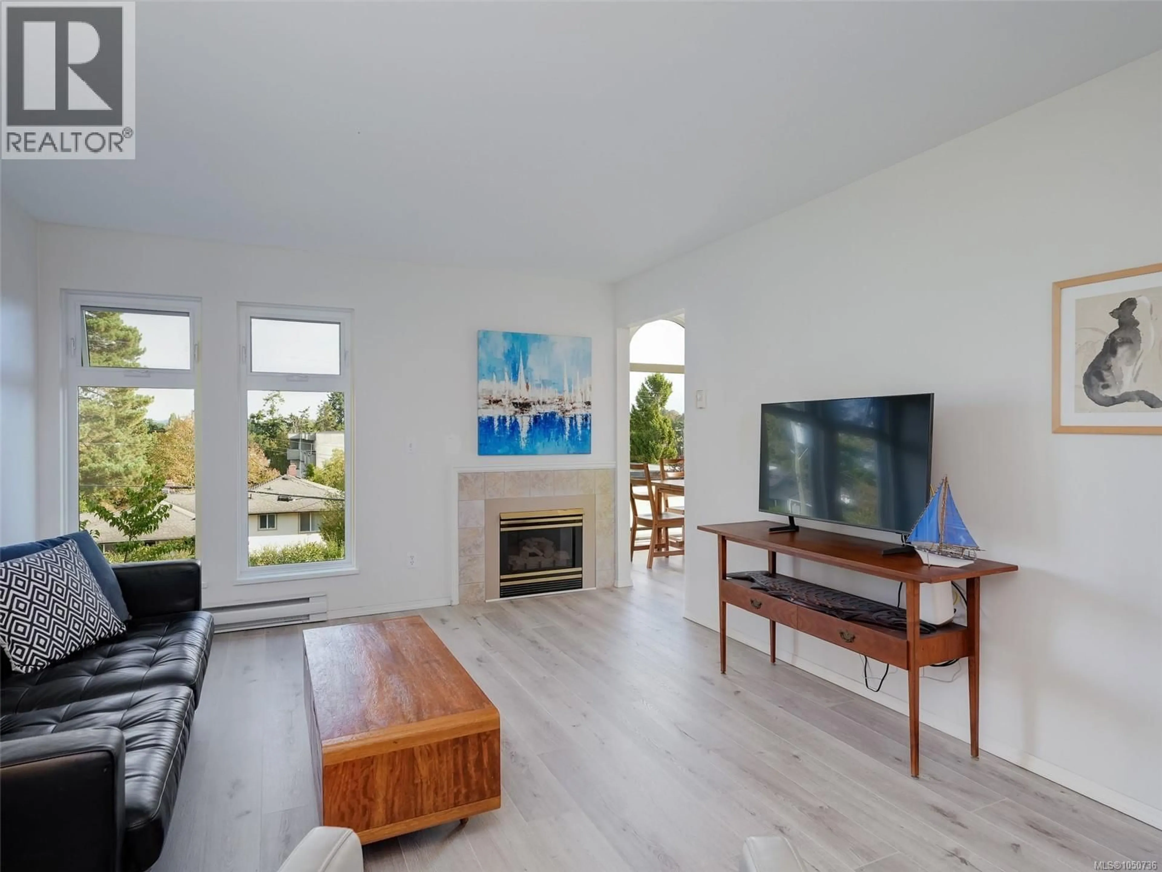 Living room with furniture, wood/laminate floor for 301 - 837 SELKIRK AVENUE, Esquimalt British Columbia V9A2T7