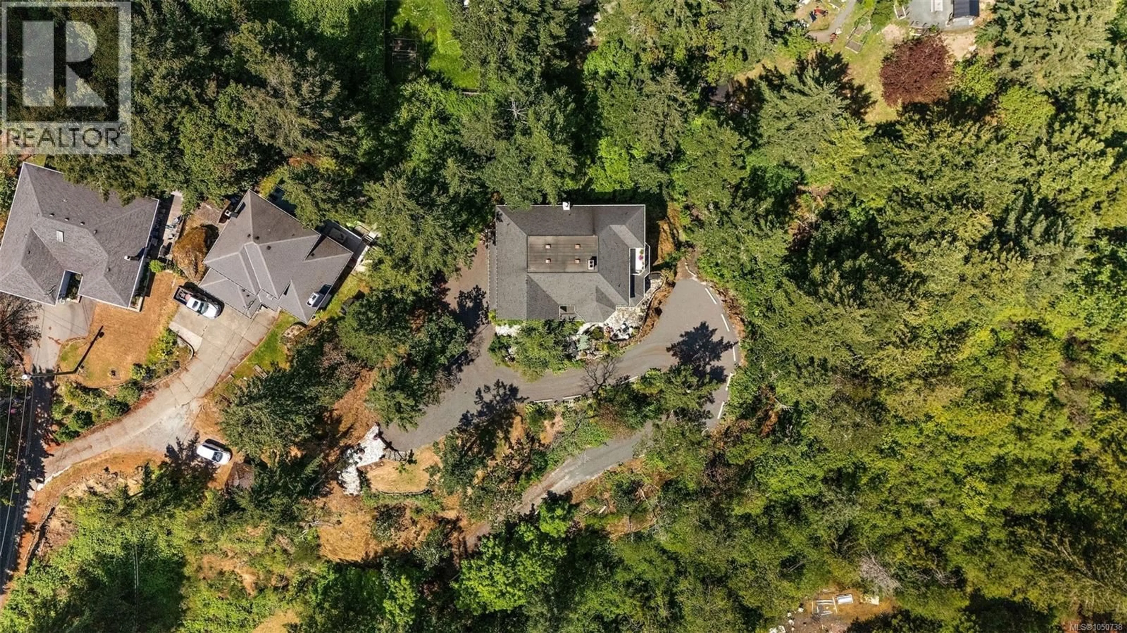 A pic from outside/outdoor area/front of a property/back of a property/a pic from drone, forest/trees view for 405 CORALEE PLACE, Langford British Columbia V9B6C4