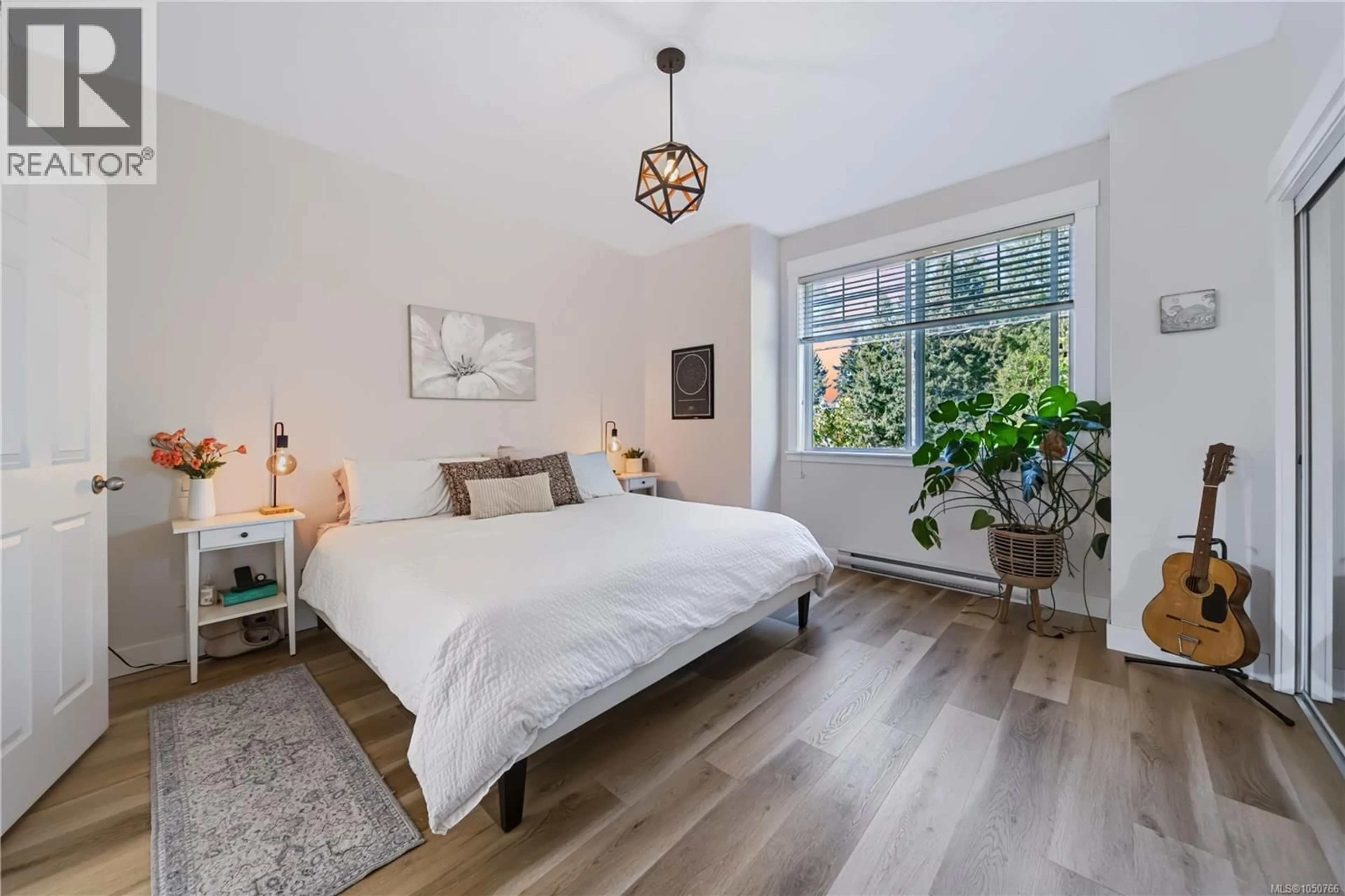 Bedroom with bed, wood/laminate floor for 102 - 6057 DOUMONT ROAD, Nanaimo British Columbia V9T0G3