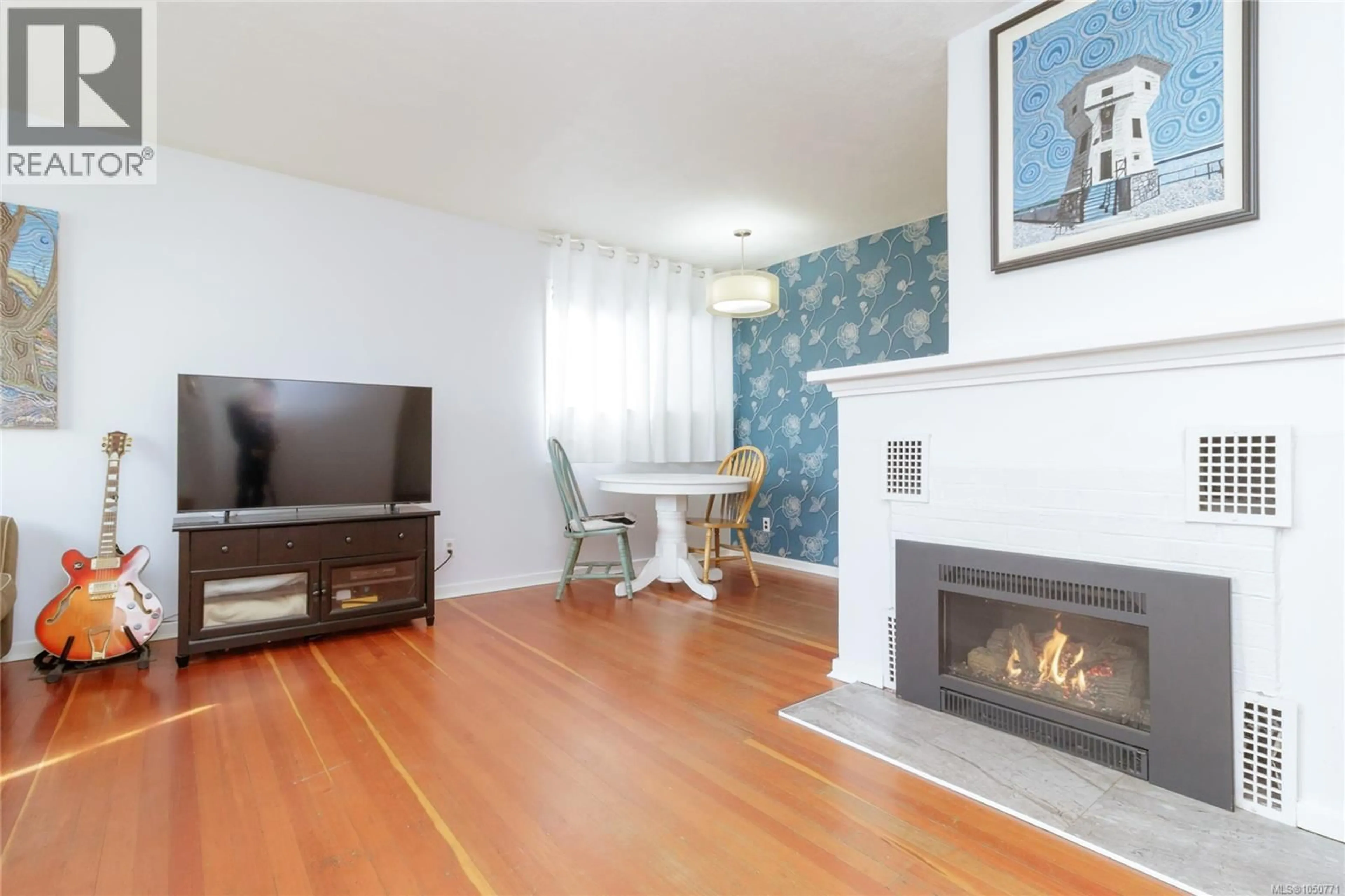 Living room with furniture, wood/laminate floor for 1747 NEWTON STREET, Victoria British Columbia V8R2R1