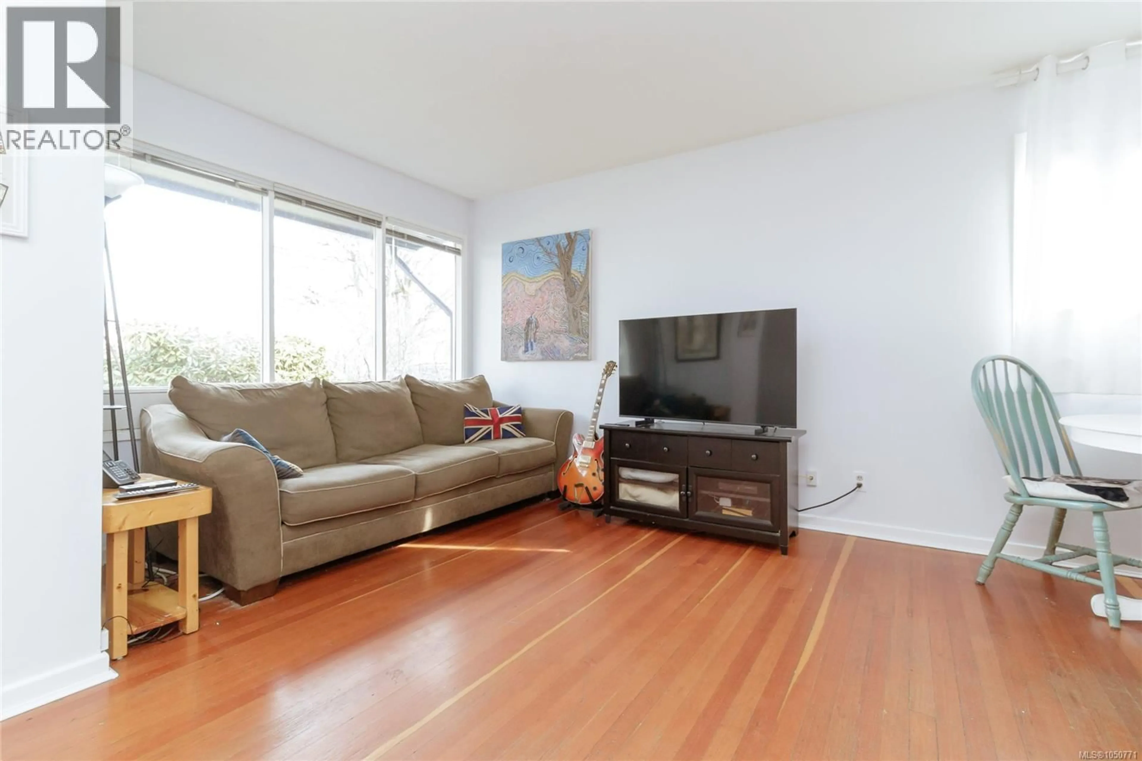 Living room with furniture, wood/laminate floor for 1747 NEWTON STREET, Victoria British Columbia V8R2R1