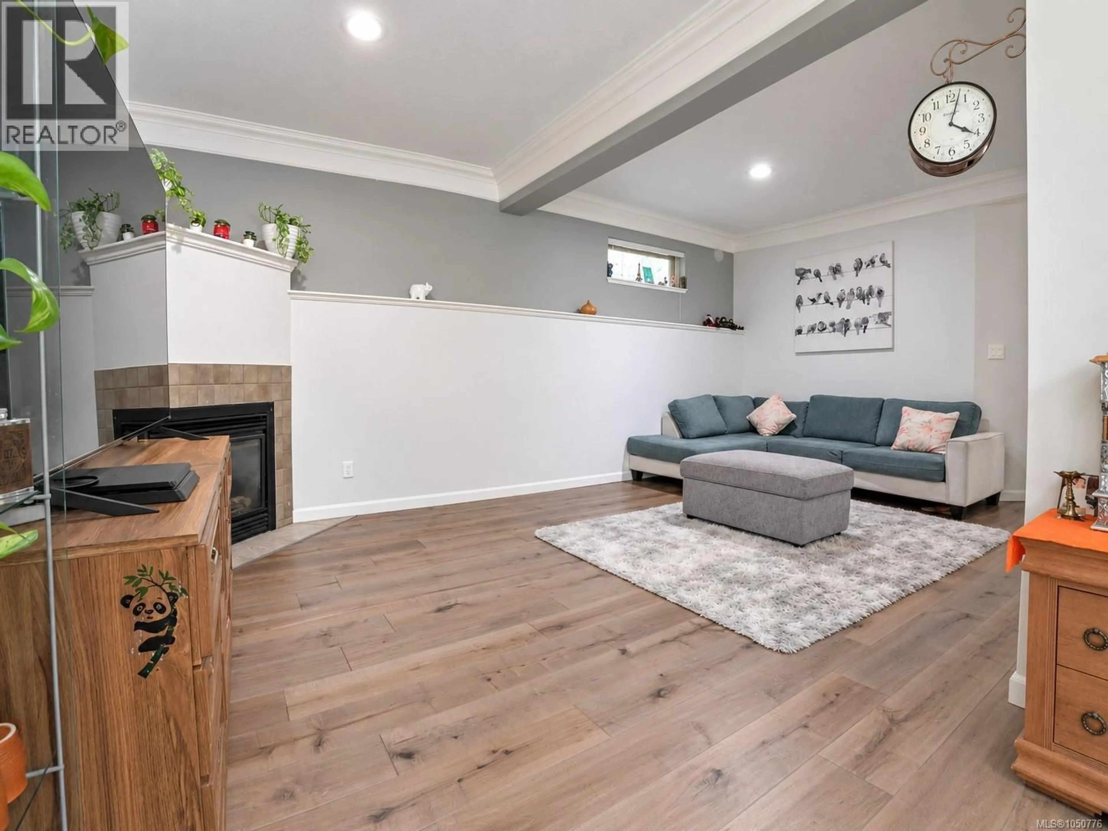 Living room with furniture, wood/laminate floor for 107 - 791 STATION AVENUE, Langford British Columbia V9B0E6