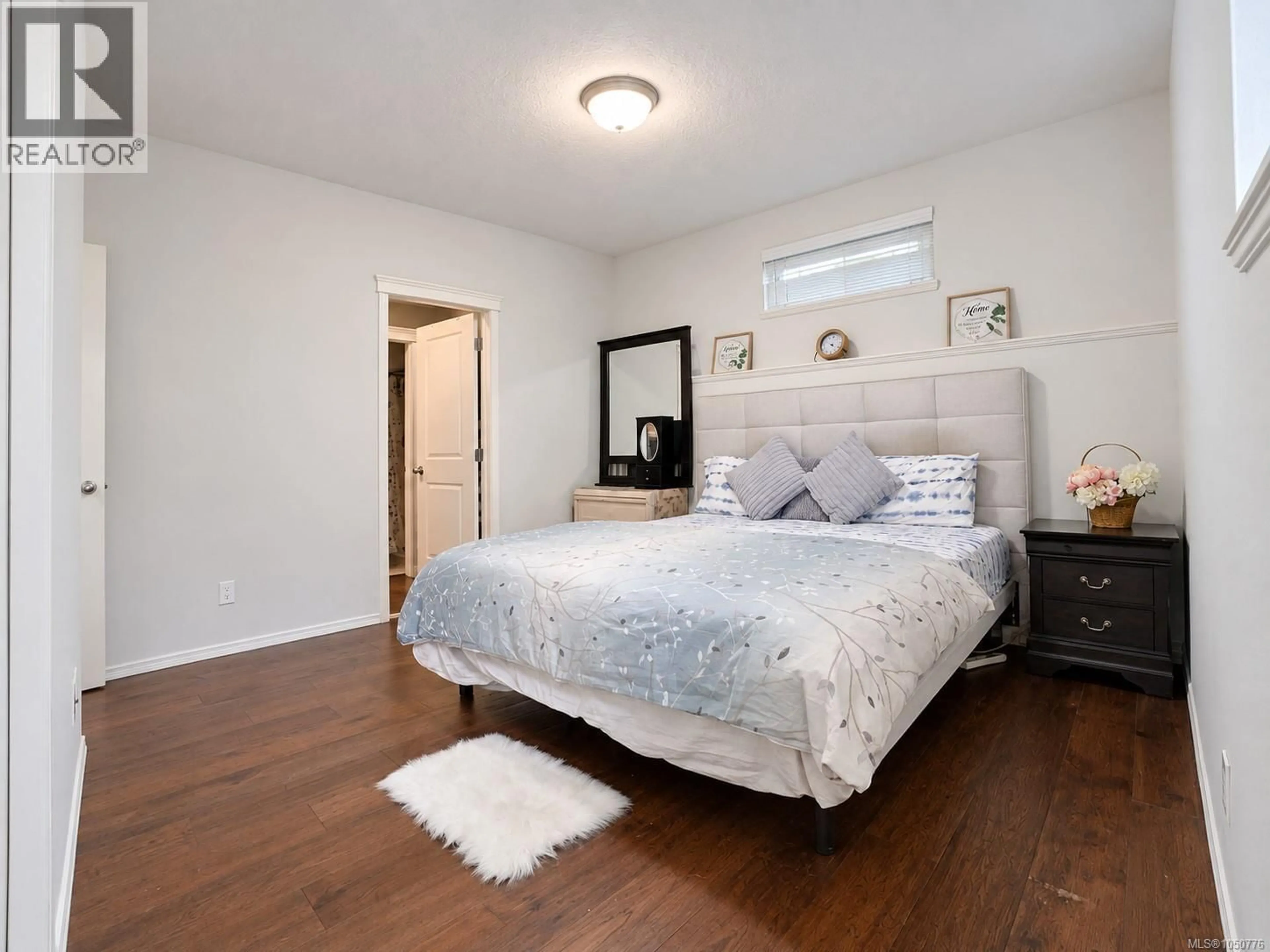 Bedroom with bed, wood/laminate floor for 107 - 791 STATION AVENUE, Langford British Columbia V9B0E6