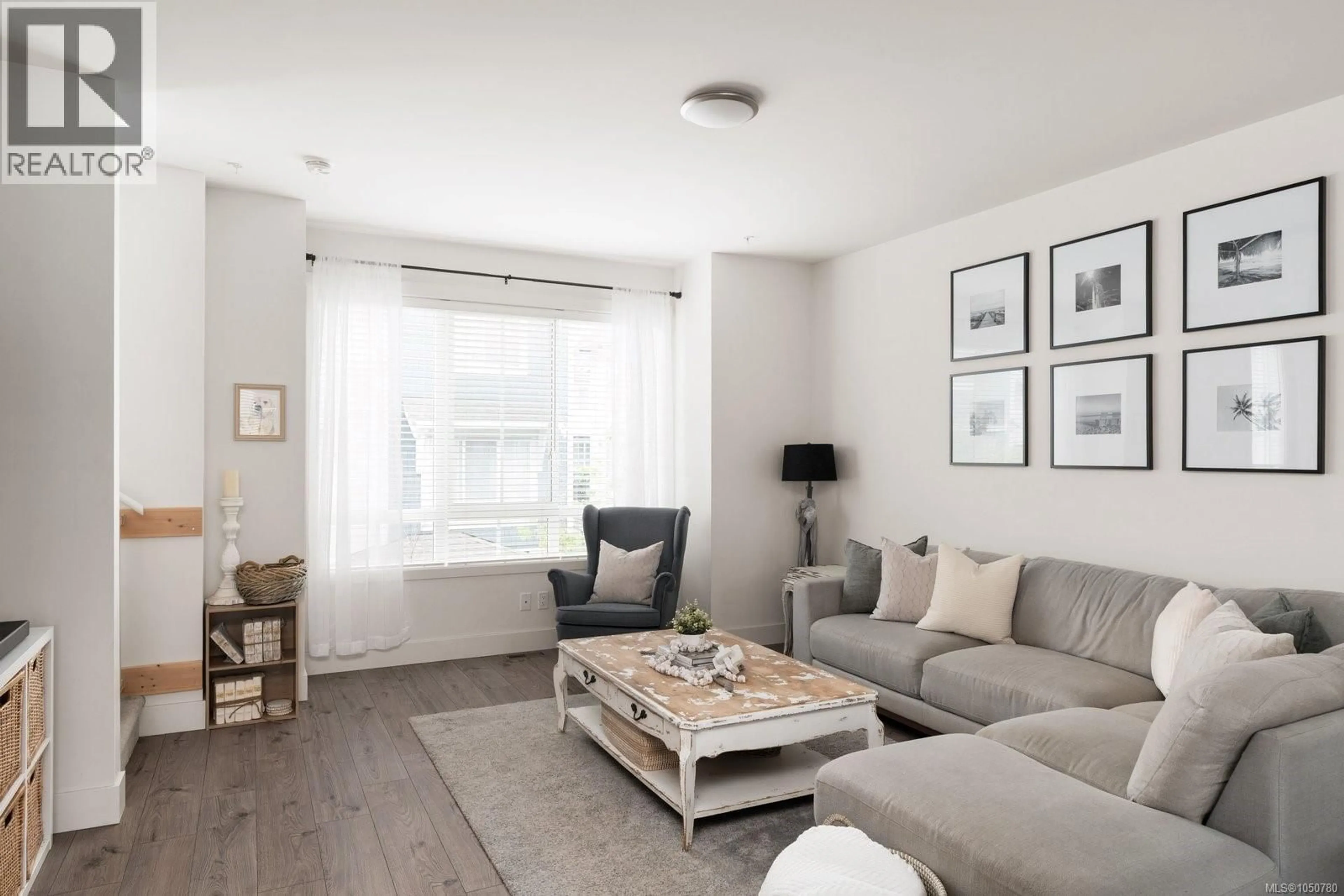 Living room with furniture, wood/laminate floor for 23 - 370 LATORIA BOULEVARD, Colwood British Columbia V9C0N9