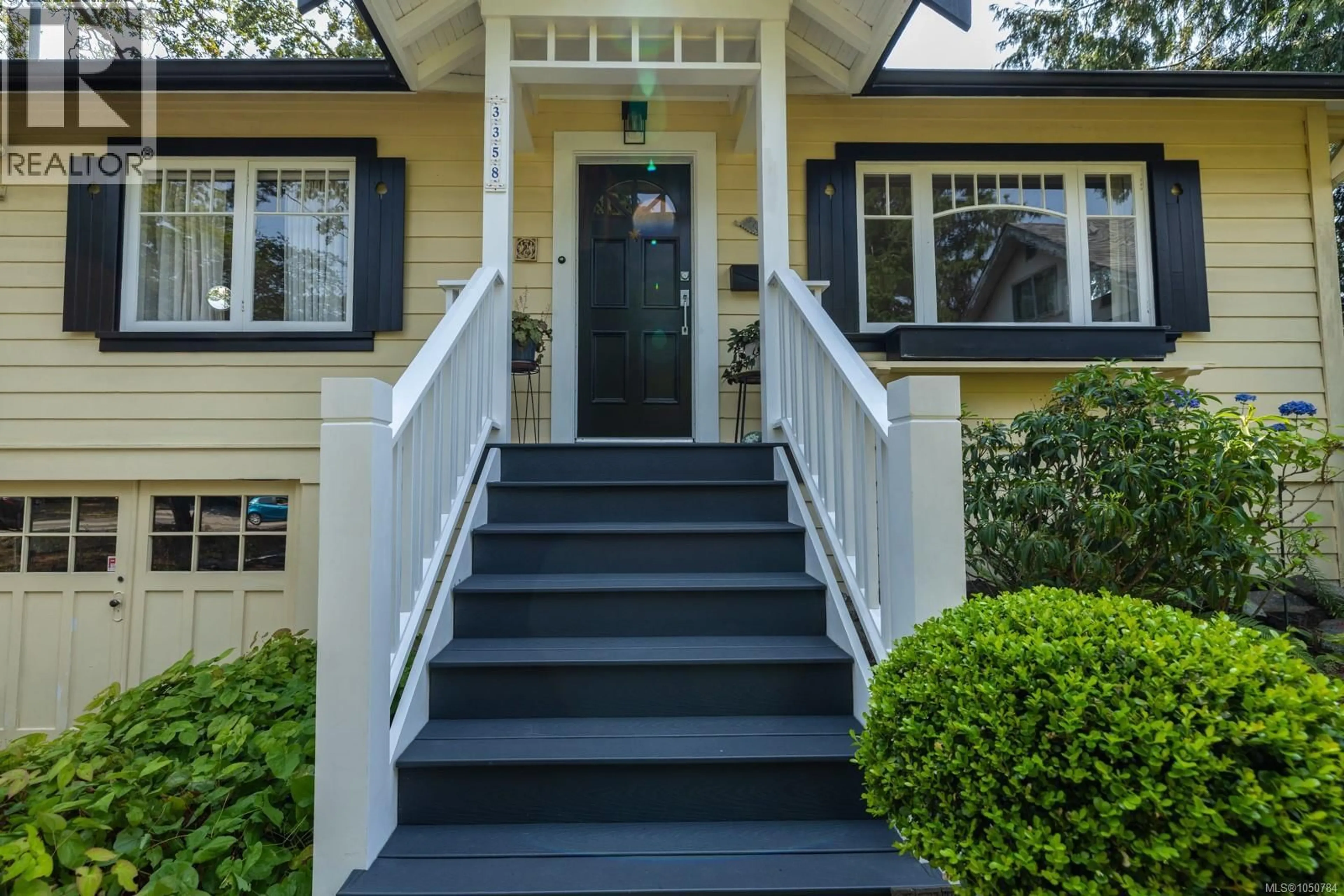 Home with vinyl exterior material, street for 3358 COOK STREET, Saanich British Columbia V8X1A8