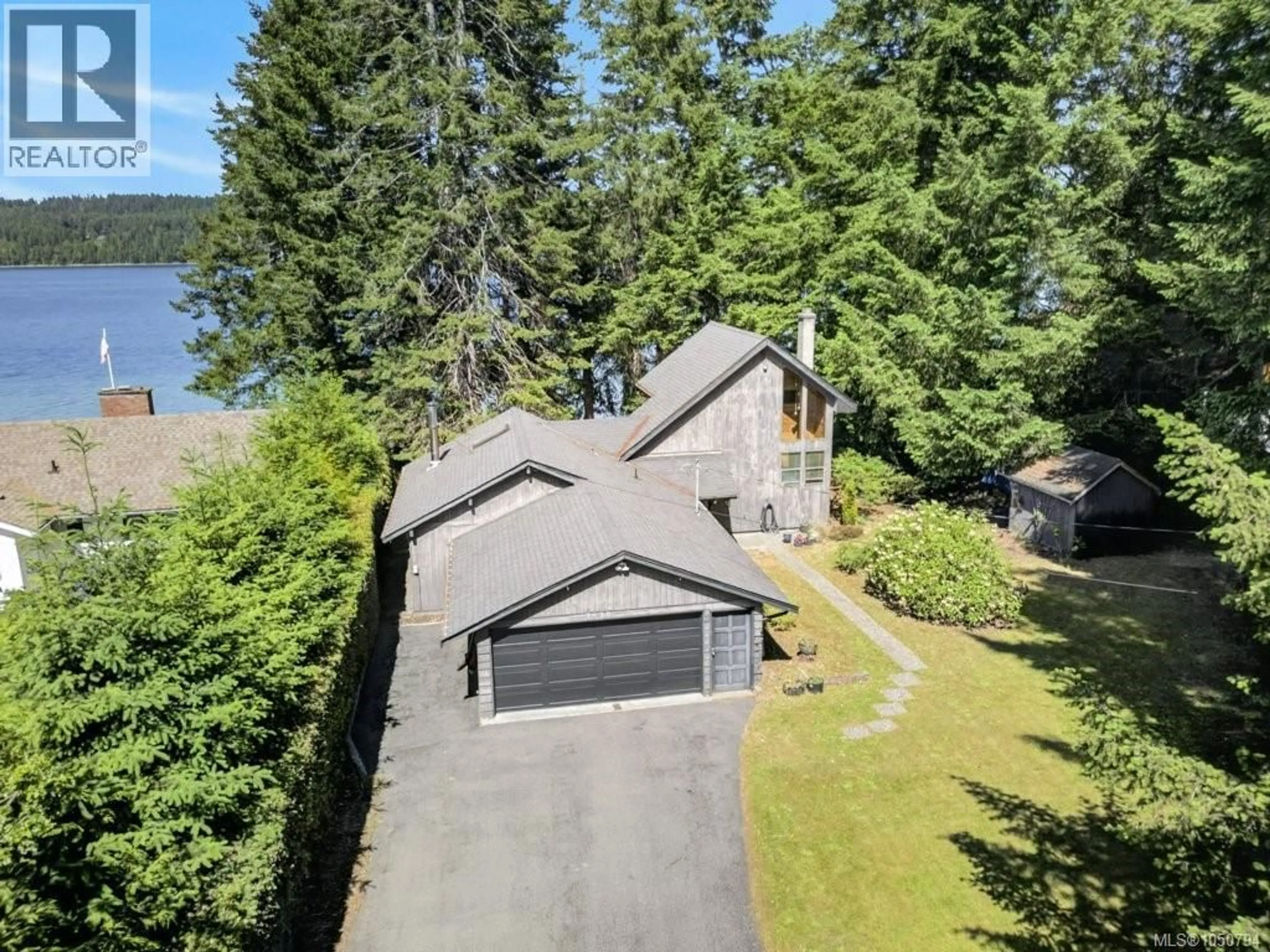 A pic from outside/outdoor area/front of a property/back of a property/a pic from drone, water/lake/river/ocean view for 7630 SHIPS POINT ROAD, Fanny Bay British Columbia V0R1W0