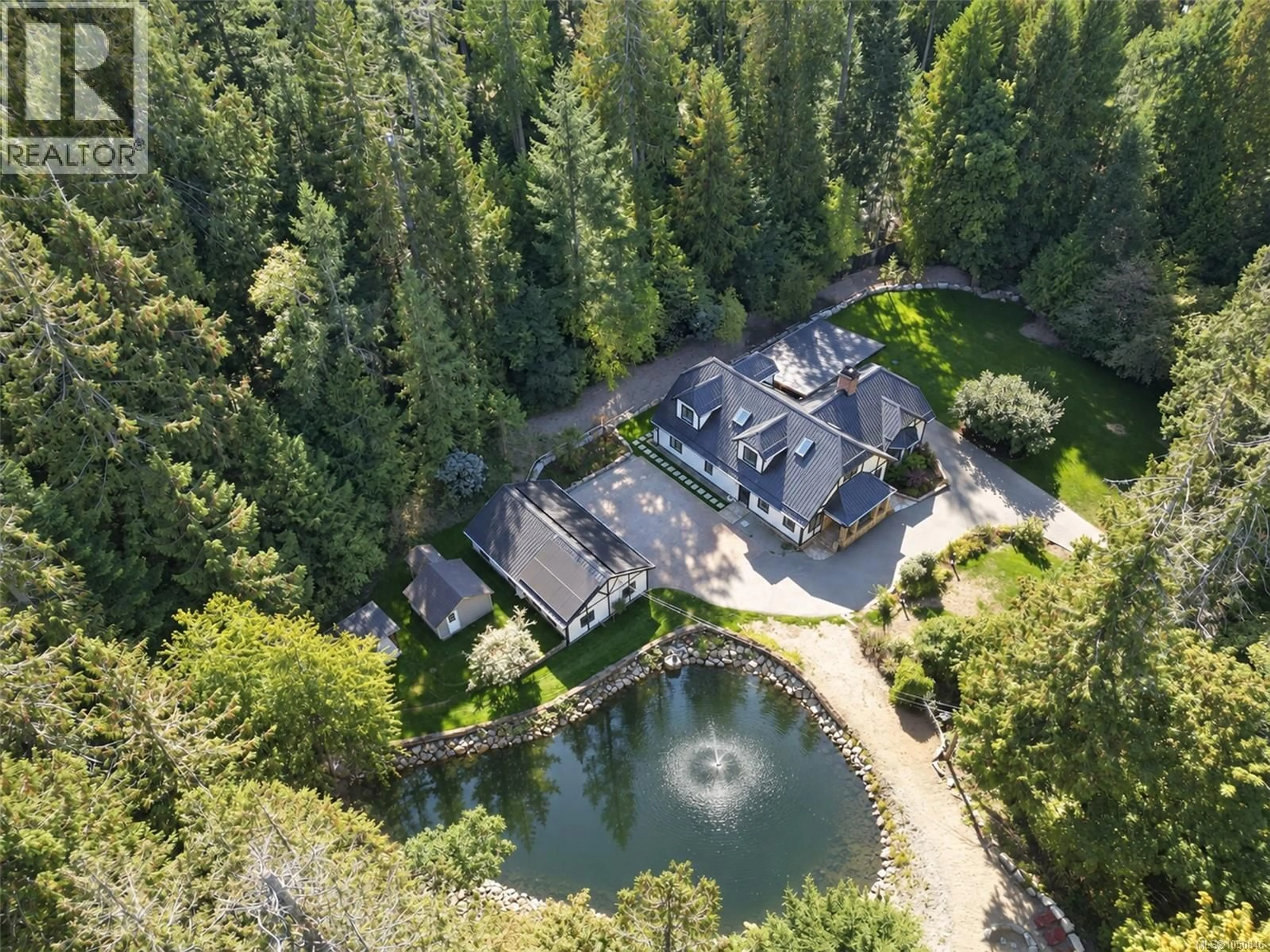 A pic from outside/outdoor area/front of a property/back of a property/a pic from drone, forest/trees view for 8401 LAWRENCE ROAD, Central Saanich British Columbia V8M1S5