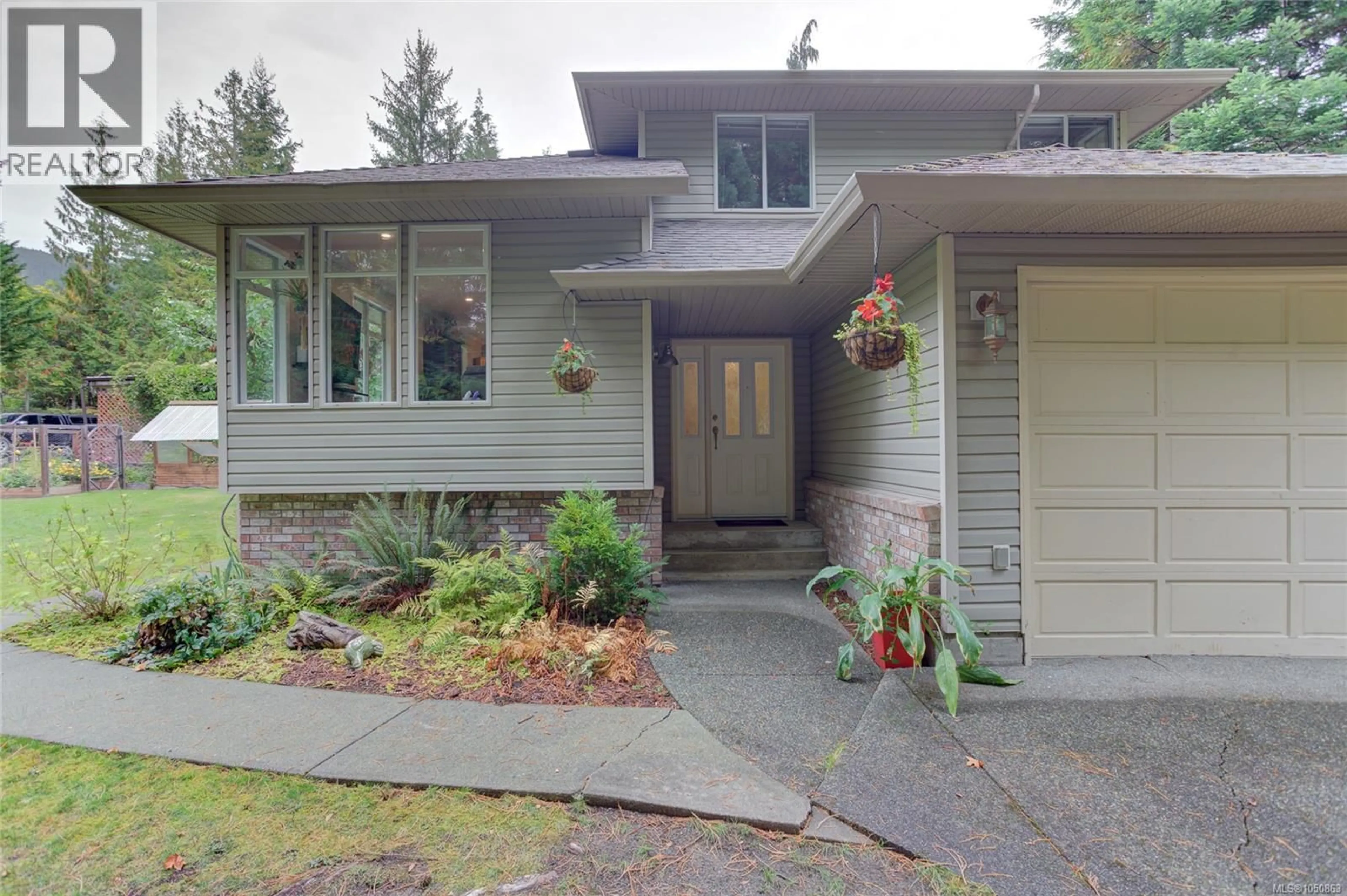 Home with vinyl exterior material, street for 100 ELK ROAD, Lake Cowichan British Columbia V0R2G0