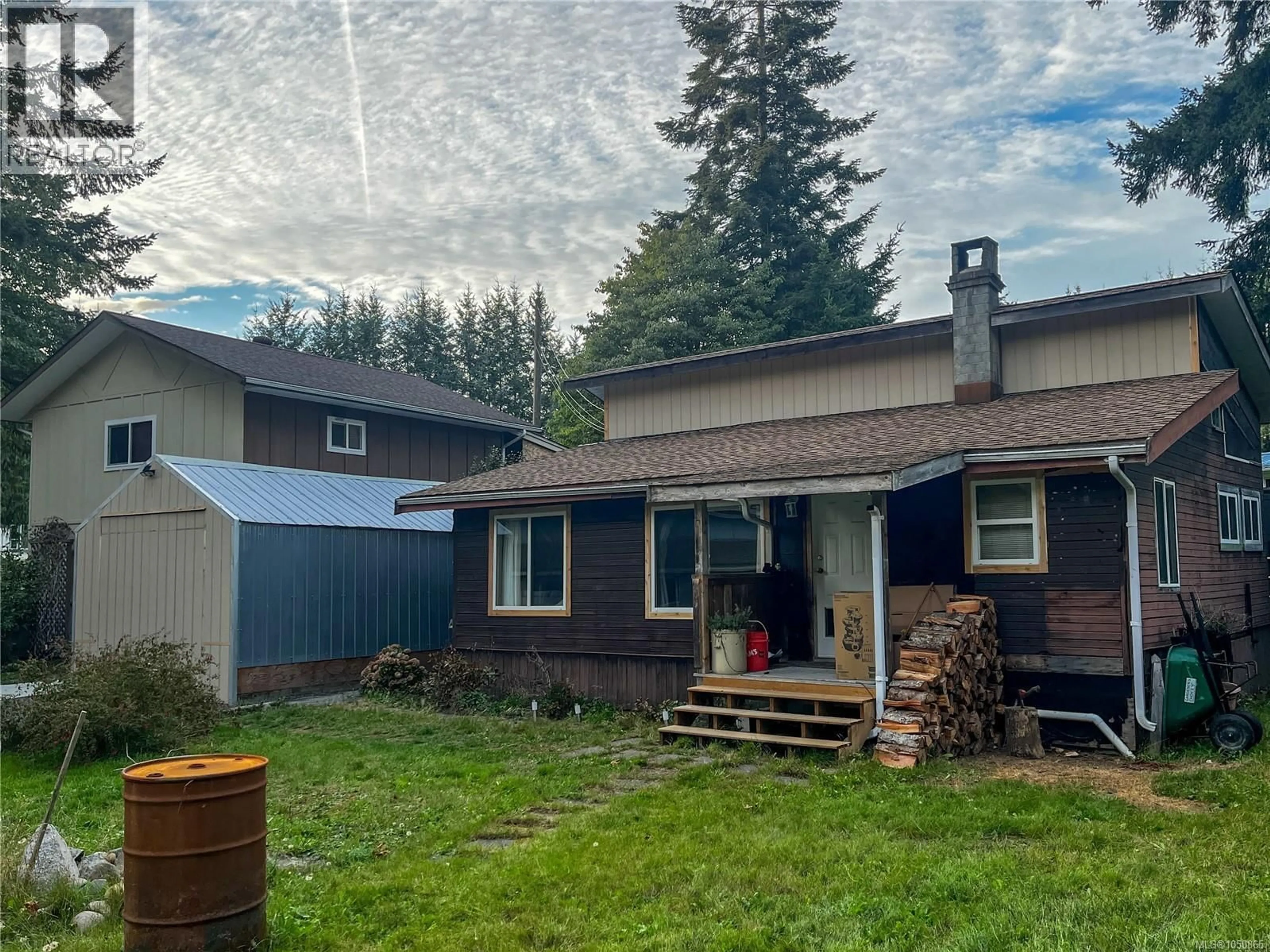 A pic from outside/outdoor area/front of a property/back of a property/a pic from drone, mountain view for 2243 FEARON ROAD, Campbell River British Columbia V9H1C7