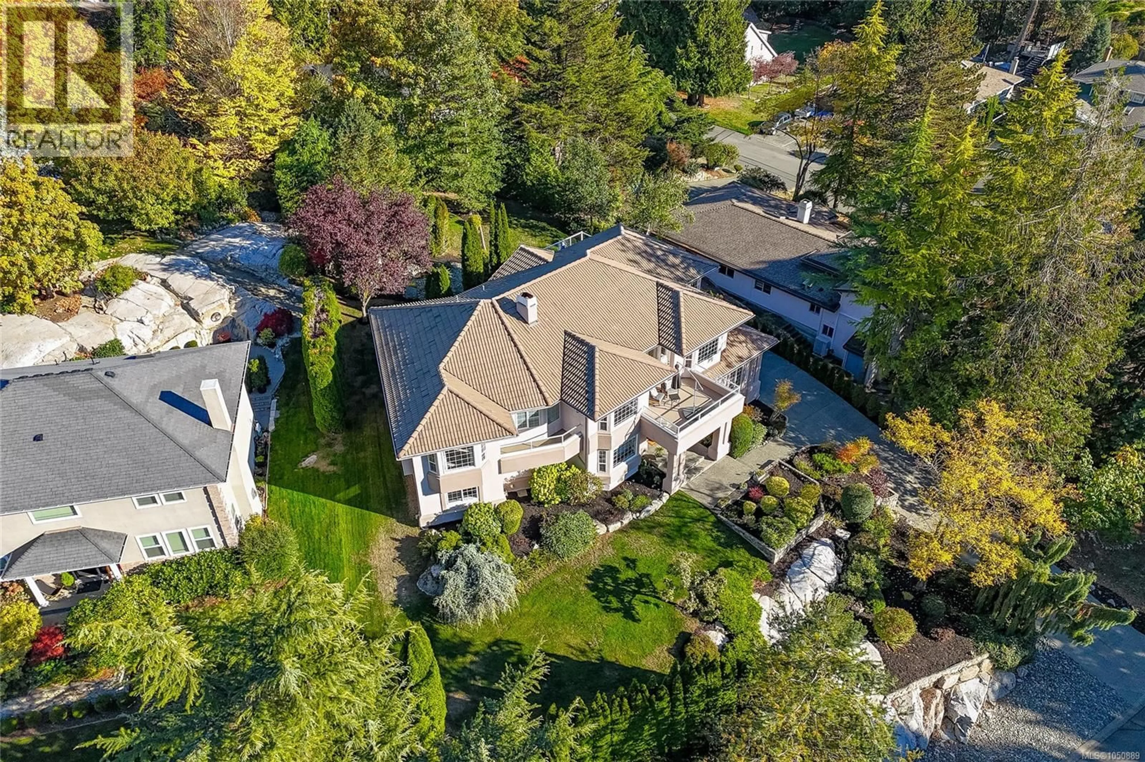 A pic from outside/outdoor area/front of a property/back of a property/a pic from drone, street for 8593 KINGCOME CRESCENT, North Saanich British Columbia V8L5C4