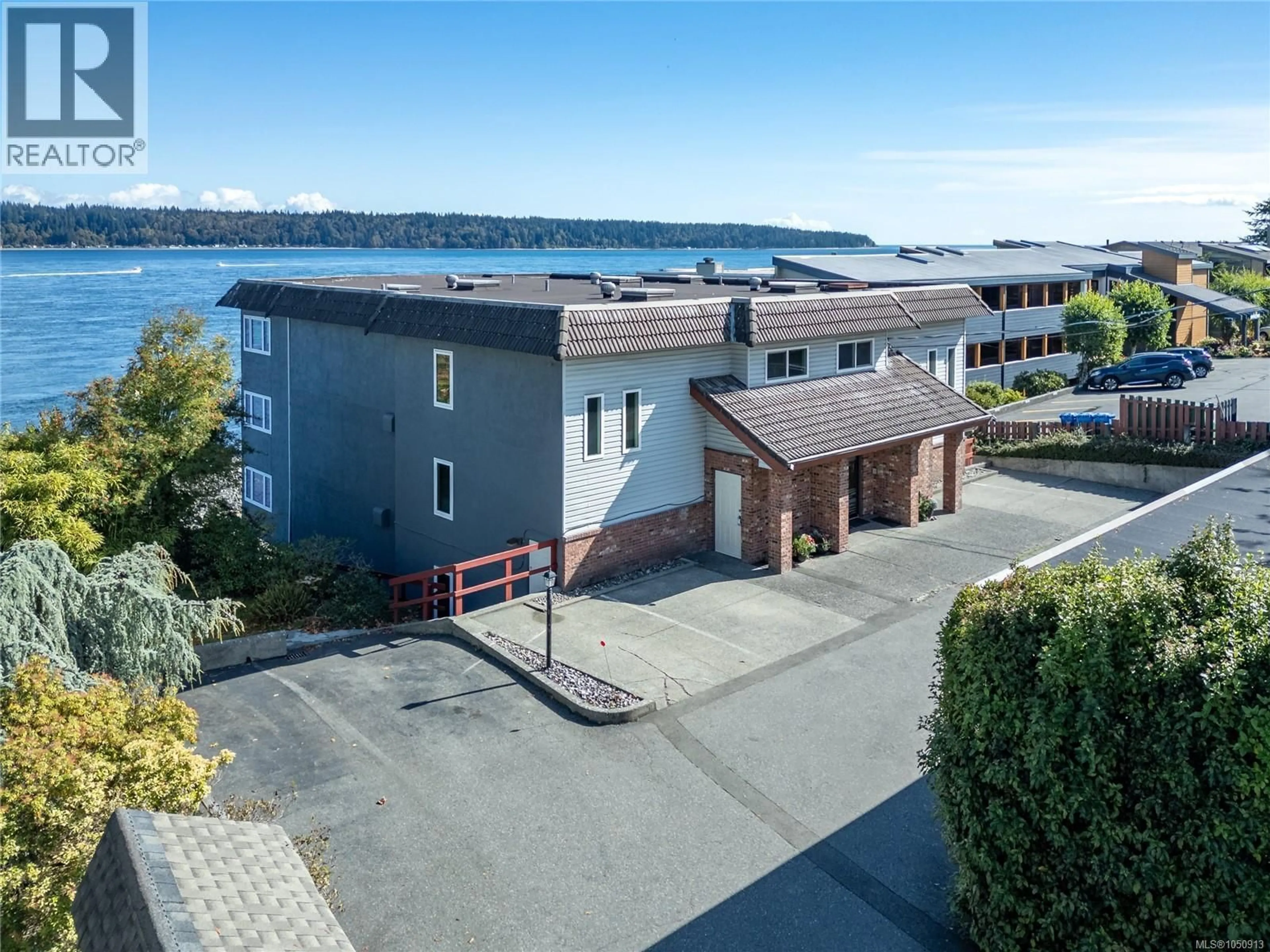 A pic from outside/outdoor area/front of a property/back of a property/a pic from drone, water/lake/river/ocean view for 3 - 553 ISLAND HIGHWAY NORTH, Campbell River British Columbia V9W2B9