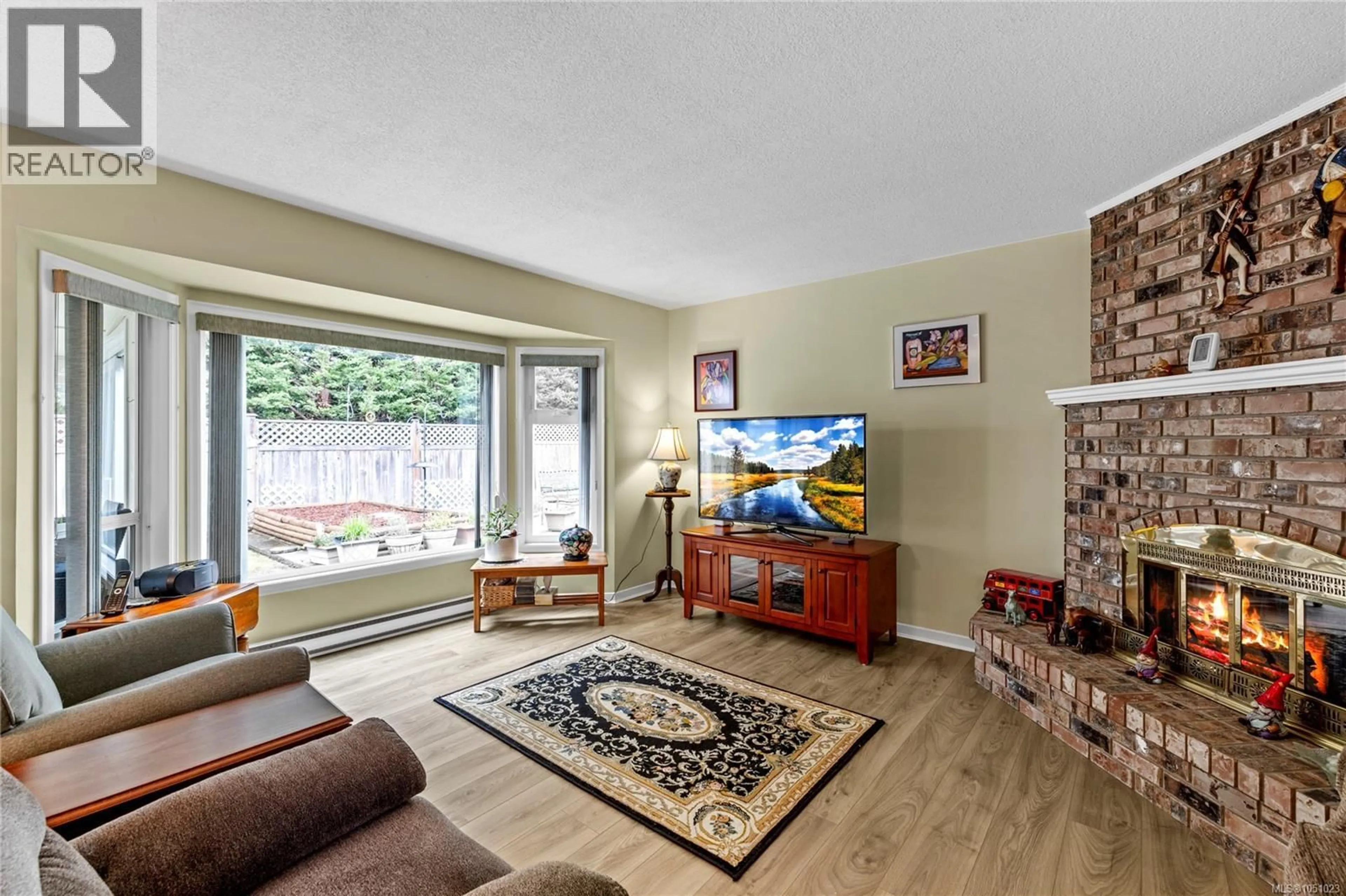 Living room with furniture, unknown for 834 REDONDA PLACE, Qualicum Beach British Columbia V9K1R4