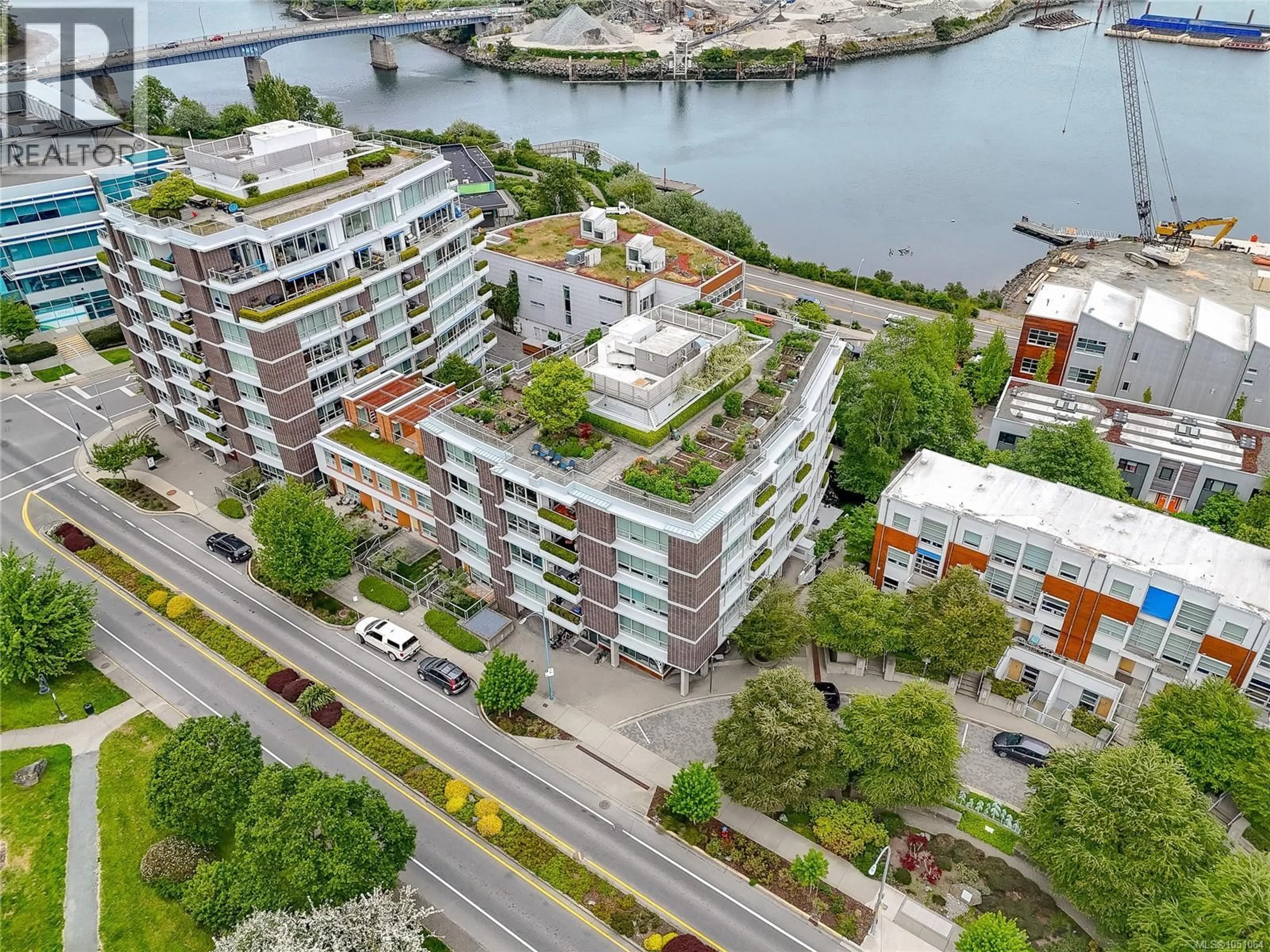 A pic from outside/outdoor area/front of a property/back of a property/a pic from drone, city buildings view from balcony for 406 - 391 TYEE ROAD, Victoria British Columbia V9A0A9