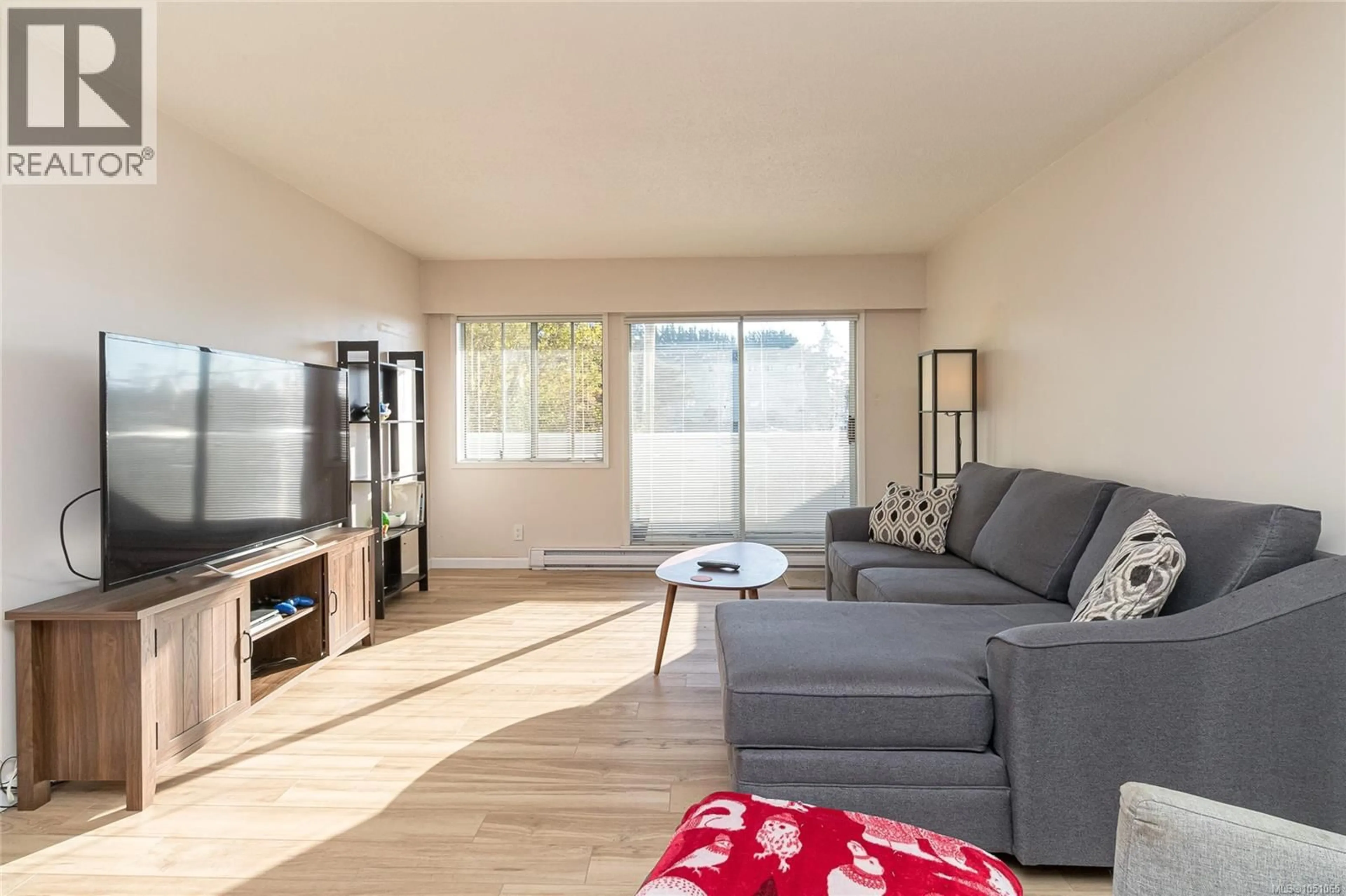 Living room with furniture, wood/laminate floor for 204 - 877 ELLERY STREET, Esquimalt British Columbia V9A4R8