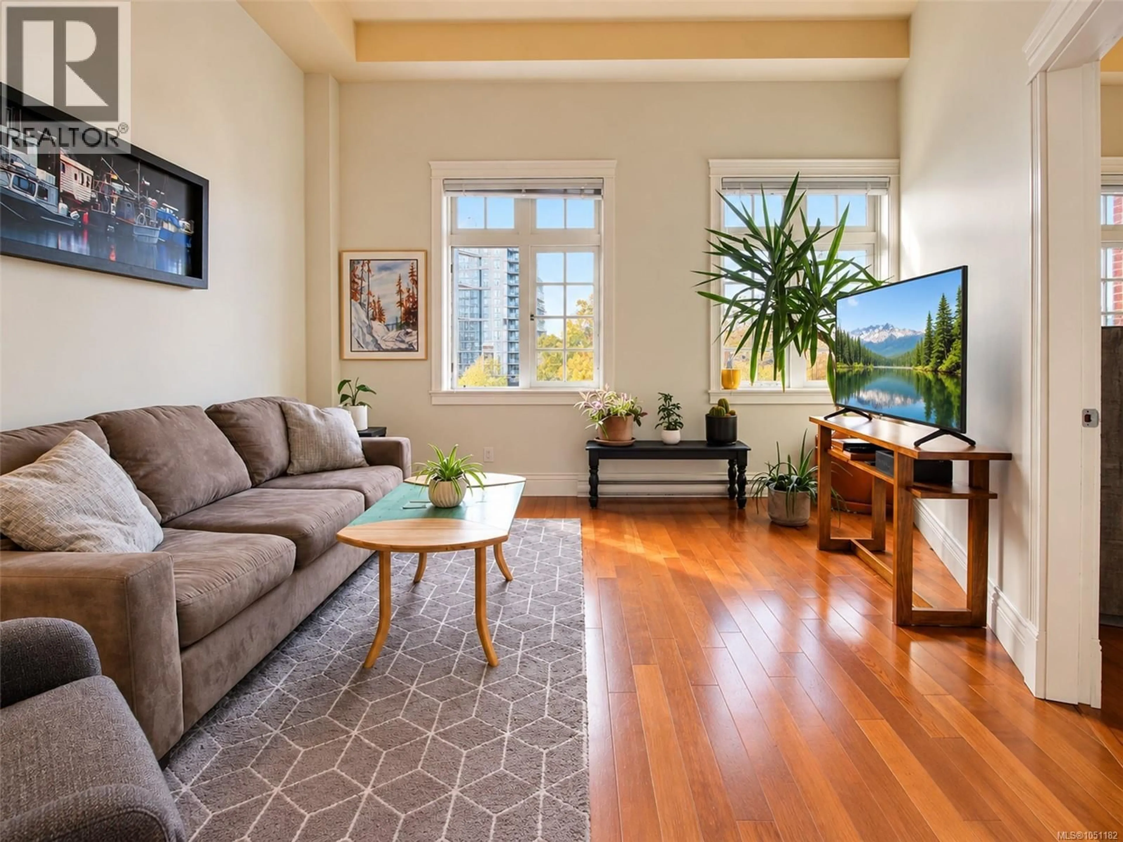 Living room with furniture, wood/laminate floor for 407 - 1602 QUADRA STREET, Victoria British Columbia V8W2L4