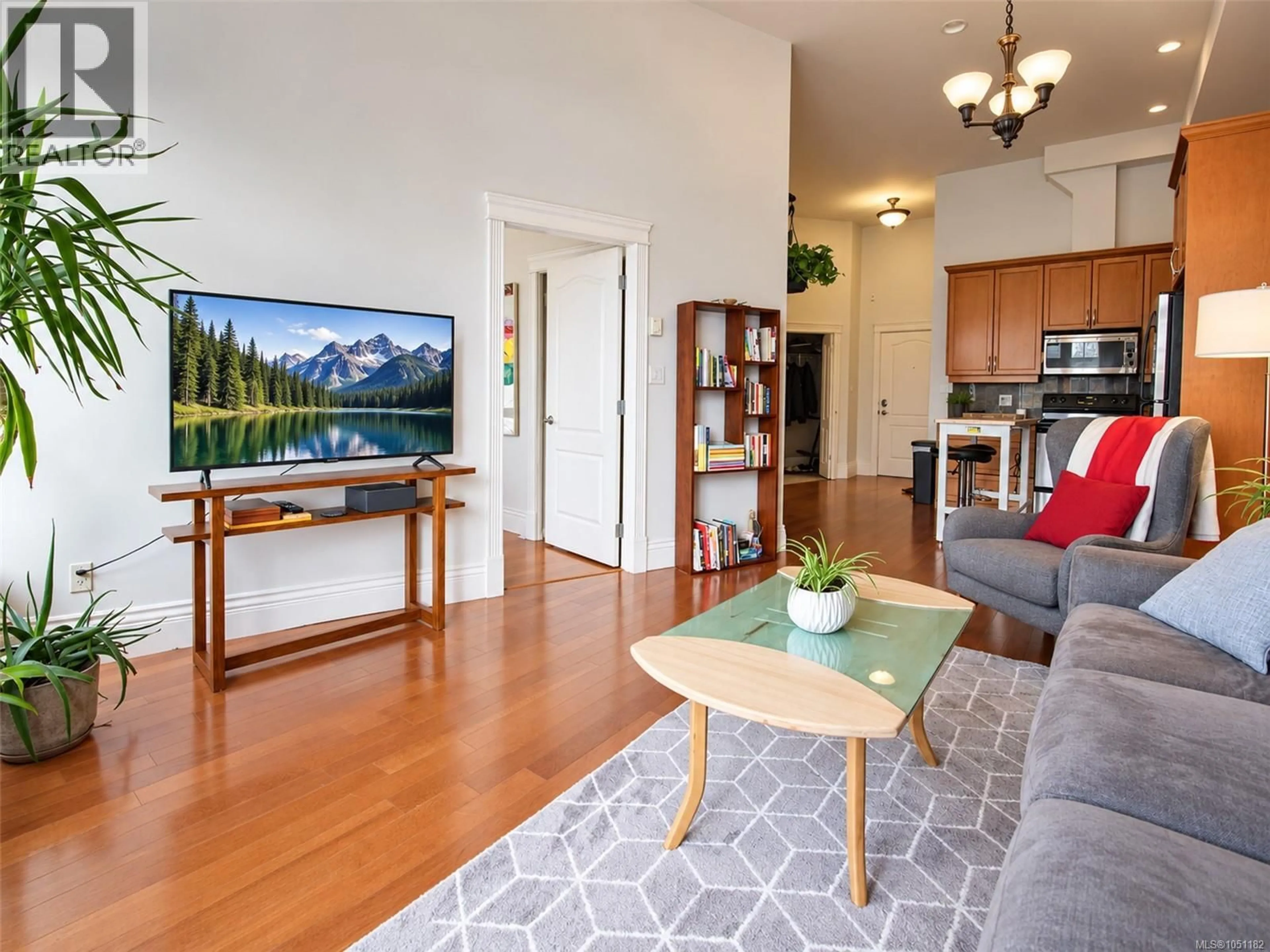 Living room with furniture, wood/laminate floor for 407 - 1602 QUADRA STREET, Victoria British Columbia V8W2L4