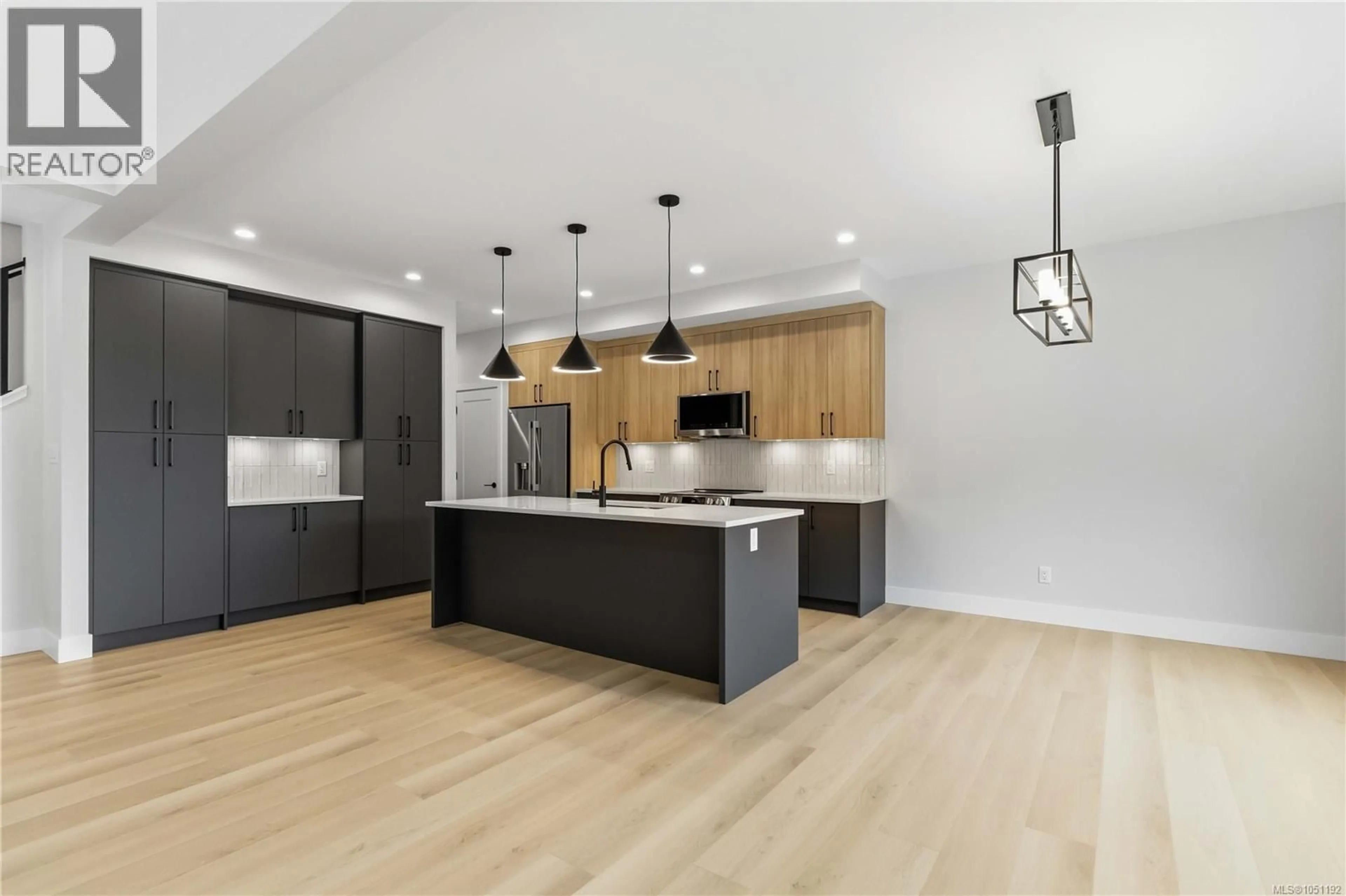 Open concept kitchen, wood/laminate floor for 3462 MERLOT TERRACE, Langford British Columbia V9C0N6