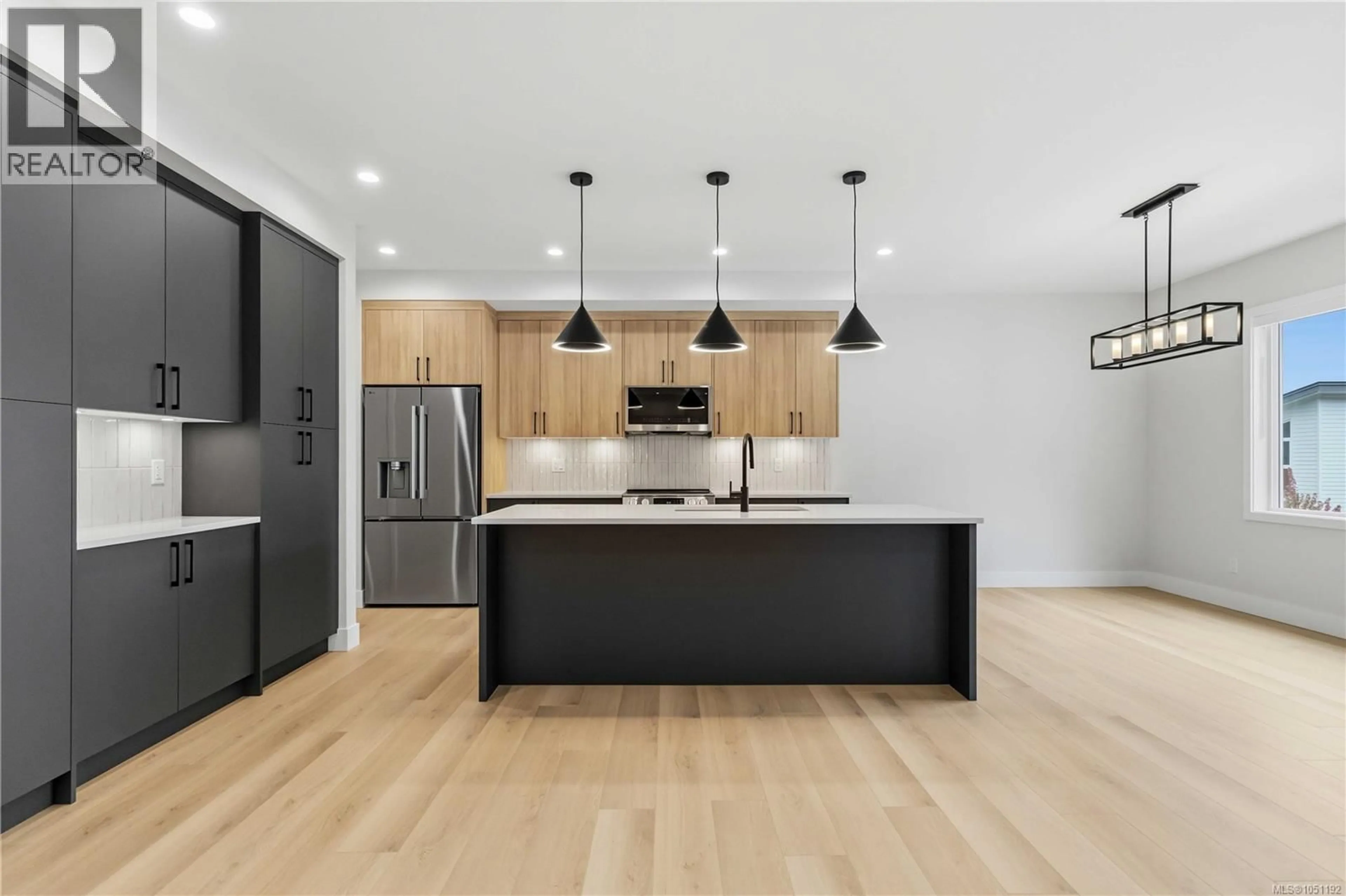 Open concept kitchen, wood/laminate floor for 3462 MERLOT TERRACE, Langford British Columbia V9C0N6