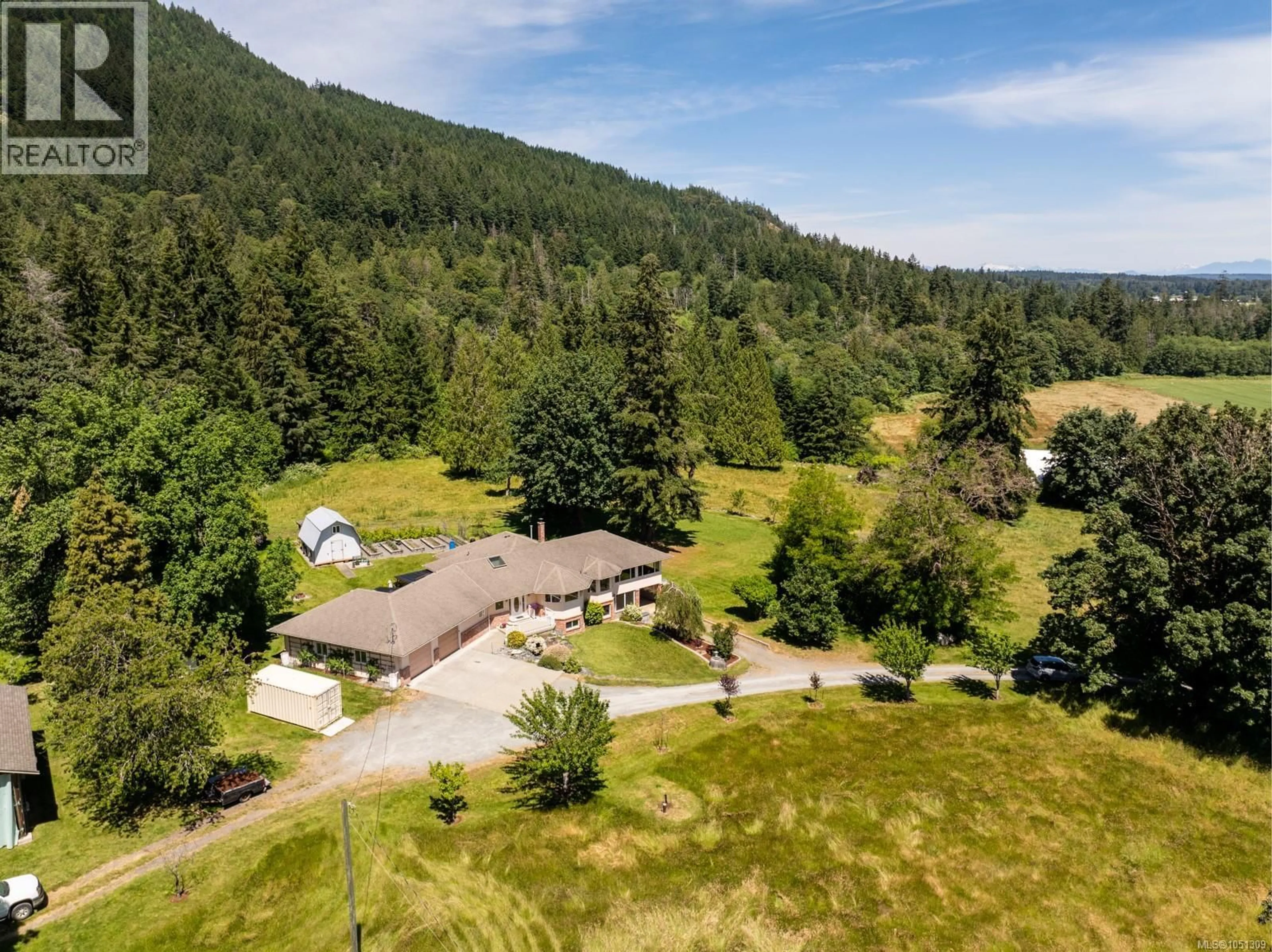 A pic from outside/outdoor area/front of a property/back of a property/a pic from drone, mountain view for 7028 WESTHOLME ROAD, Westholme British Columbia V9L6B4