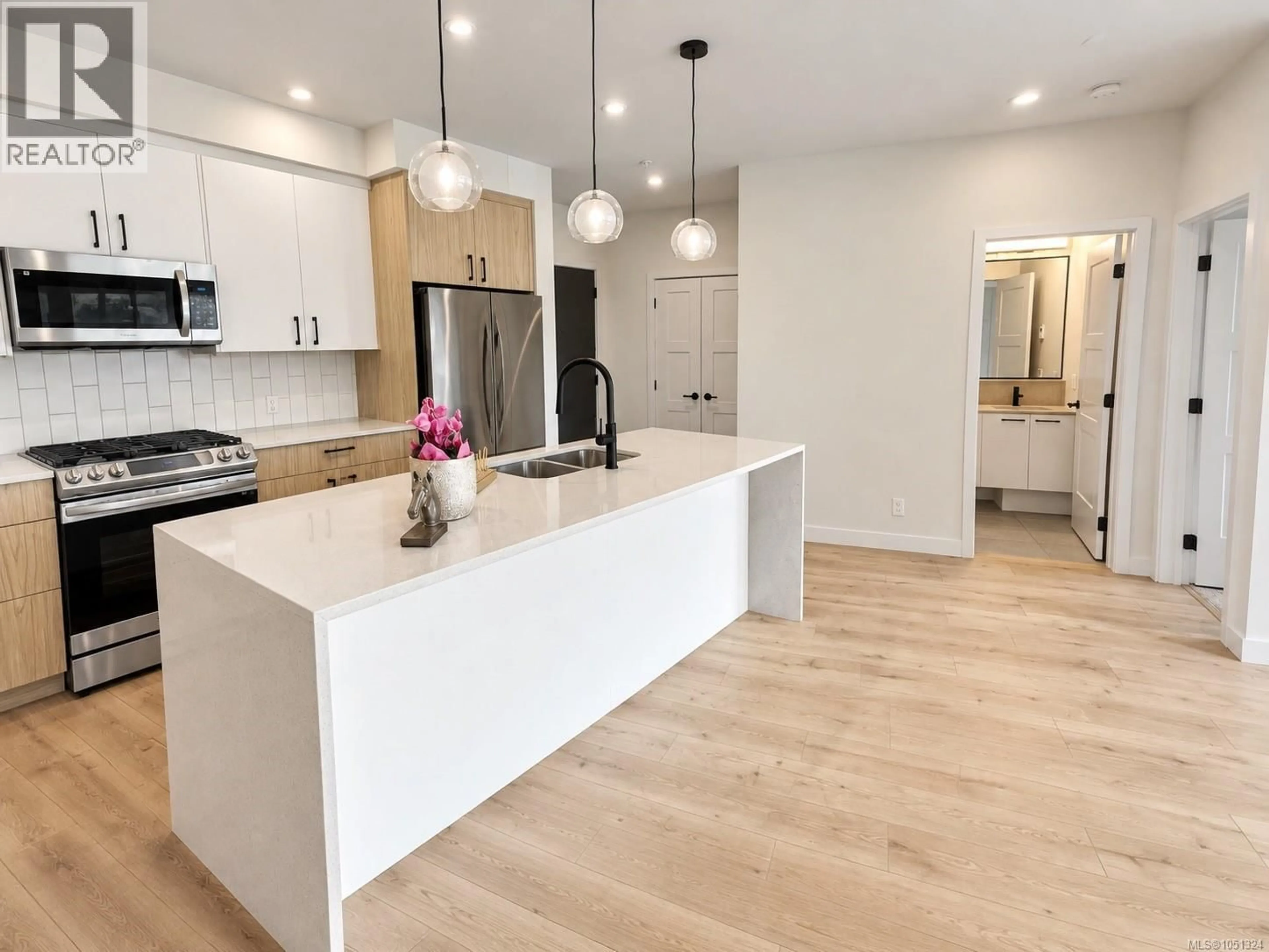 Open concept kitchen, wood/laminate floor for 110 - 958 PHAROAH MEWS, Langford British Columbia V9B7A1