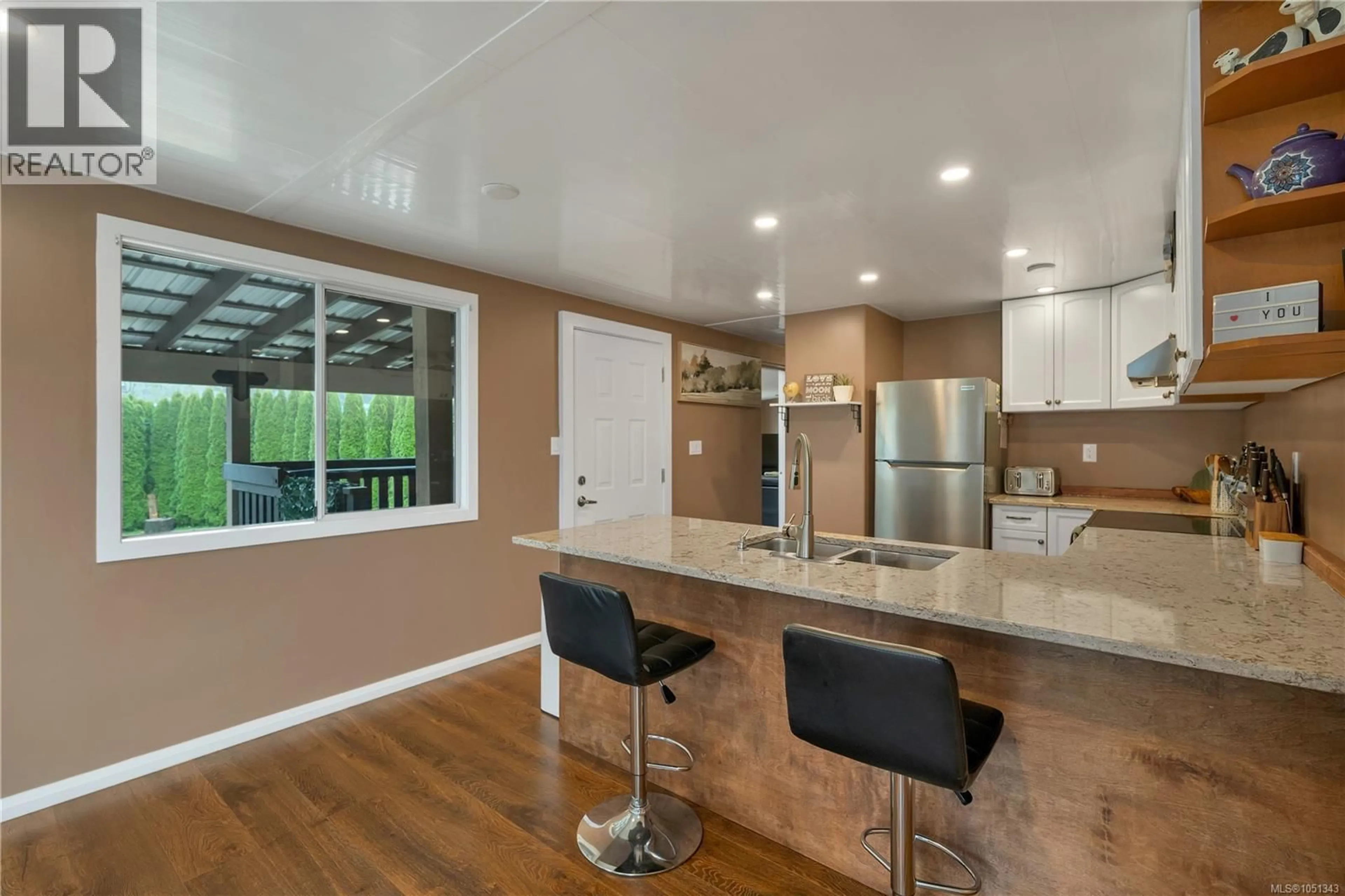 Open concept kitchen, wood/laminate floor for 81 - 5250 BEAVER HARBOUR ROAD, Port Hardy British Columbia V0N2P0