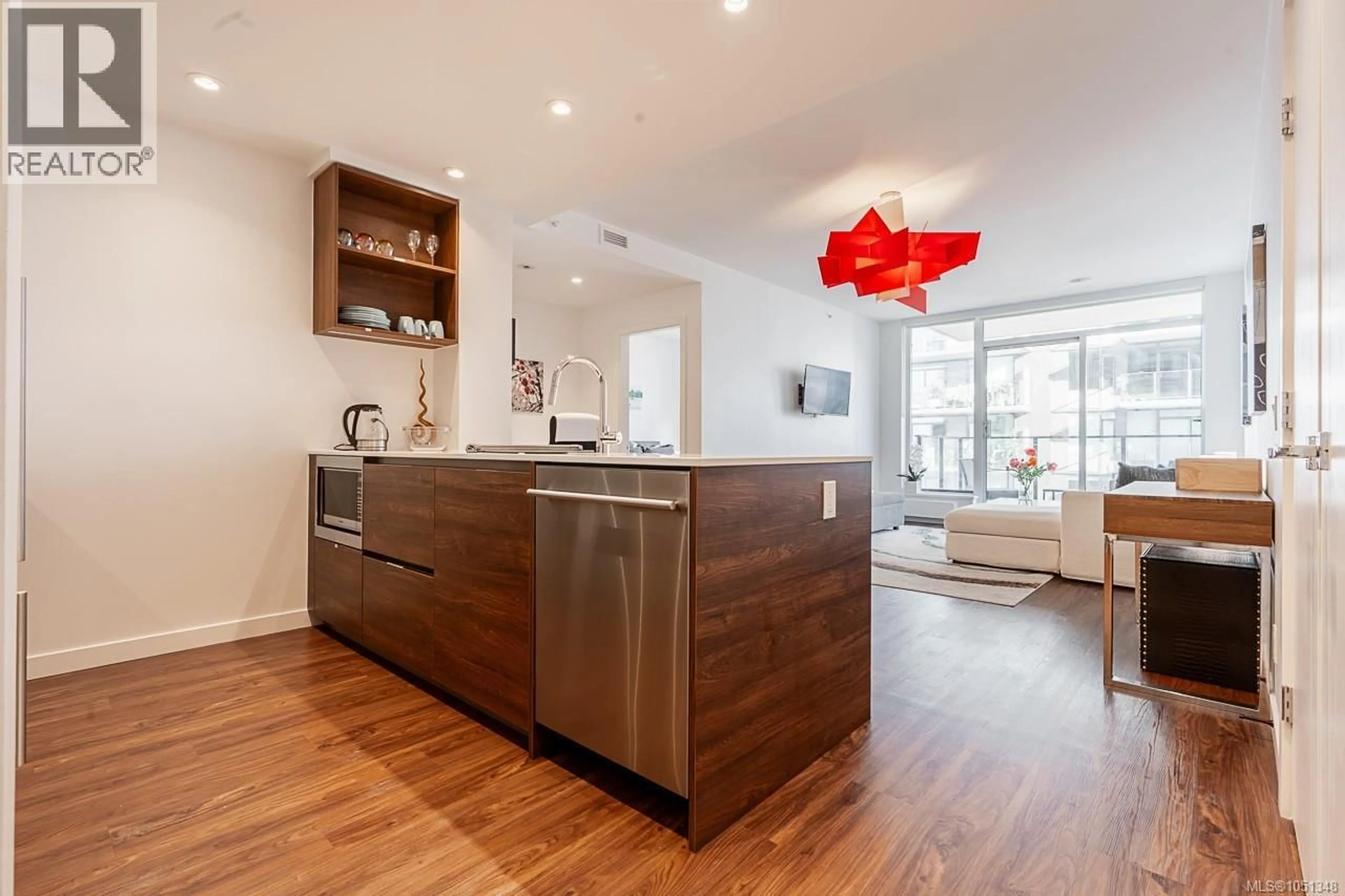 Open concept kitchen, wood/laminate floor for 604 - 369 TYEE ROAD, Victoria British Columbia V9A0B6
