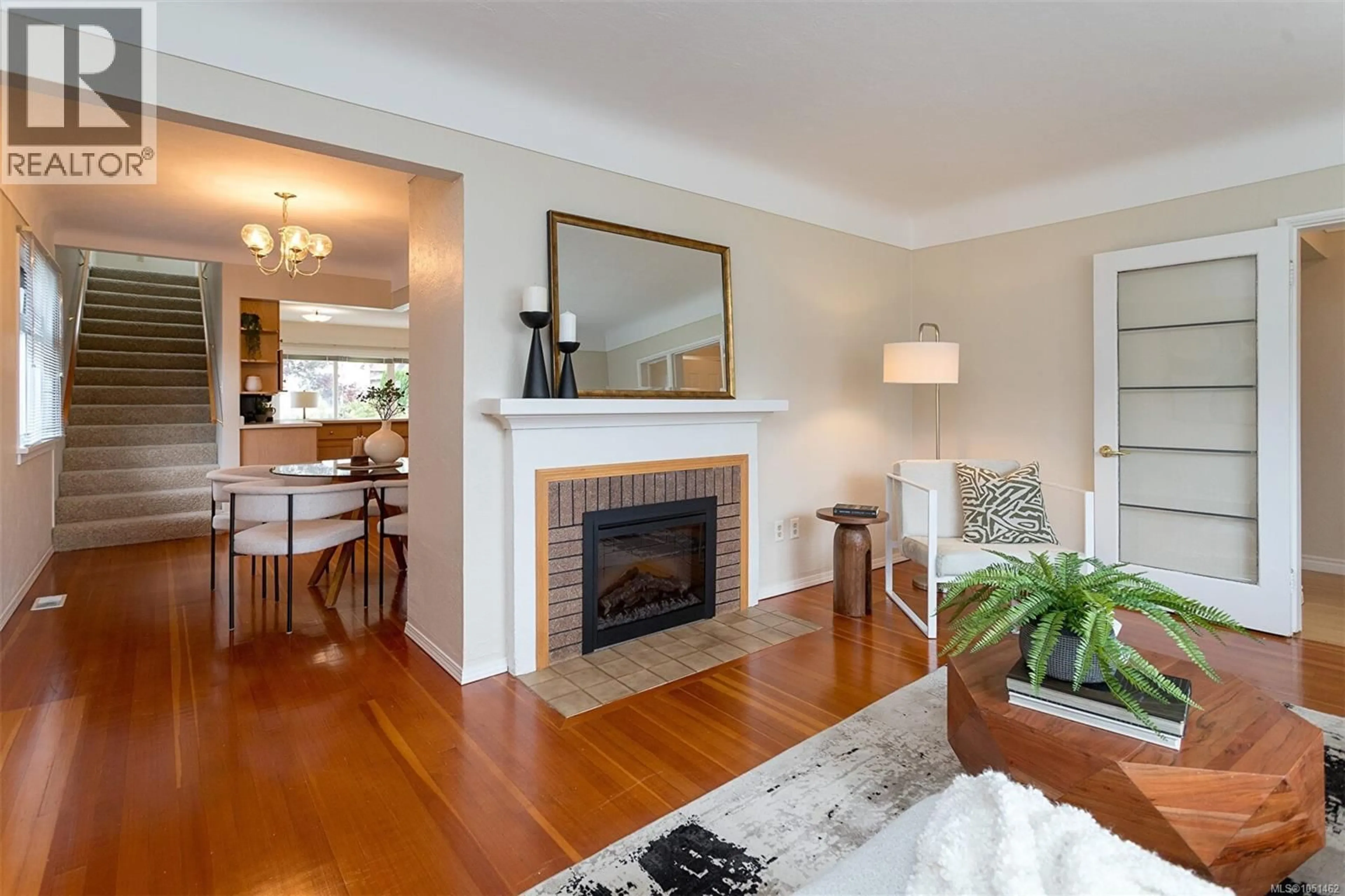 Living room with furniture, wood/laminate floor for 1679 FREEMAN AVENUE, Saanich British Columbia V8P1P5