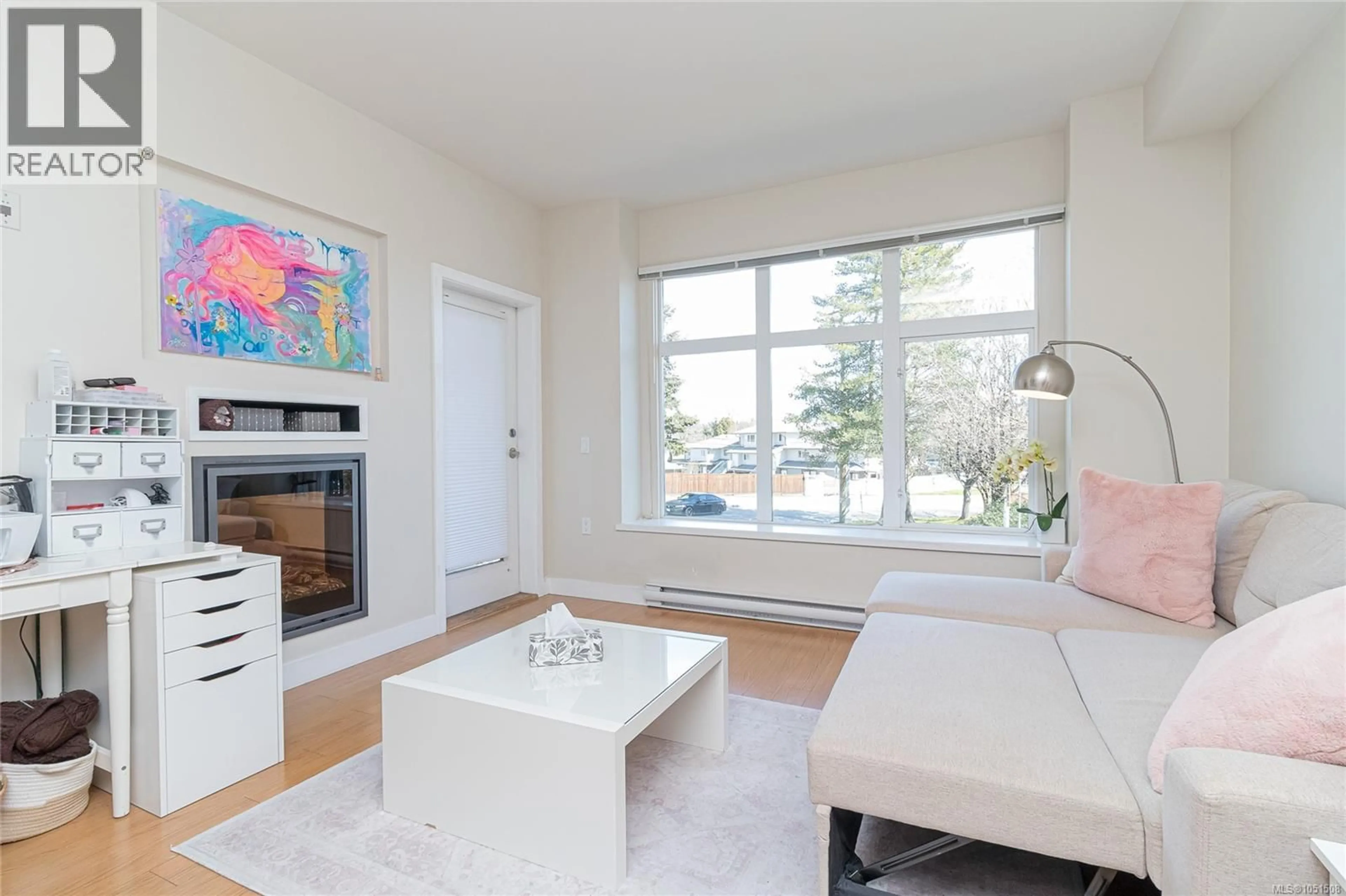 Living room with furniture, unknown for 201 - 4030 BORDEN STREET, Saanich British Columbia V8X2E9