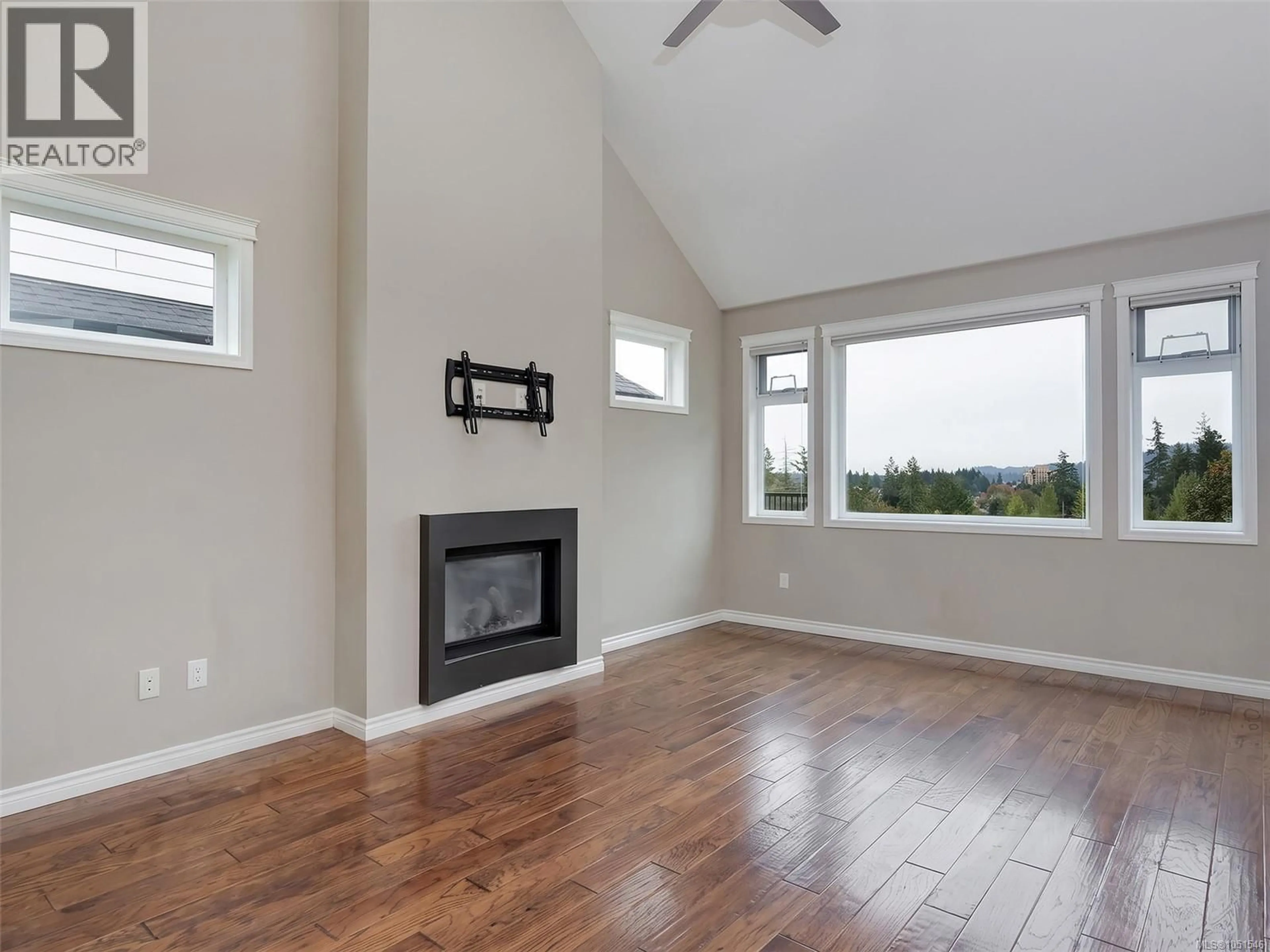 Living room with furniture, wood/laminate floor for 2526 PROSPECTOR WAY, Langford British Columbia X1X1X1