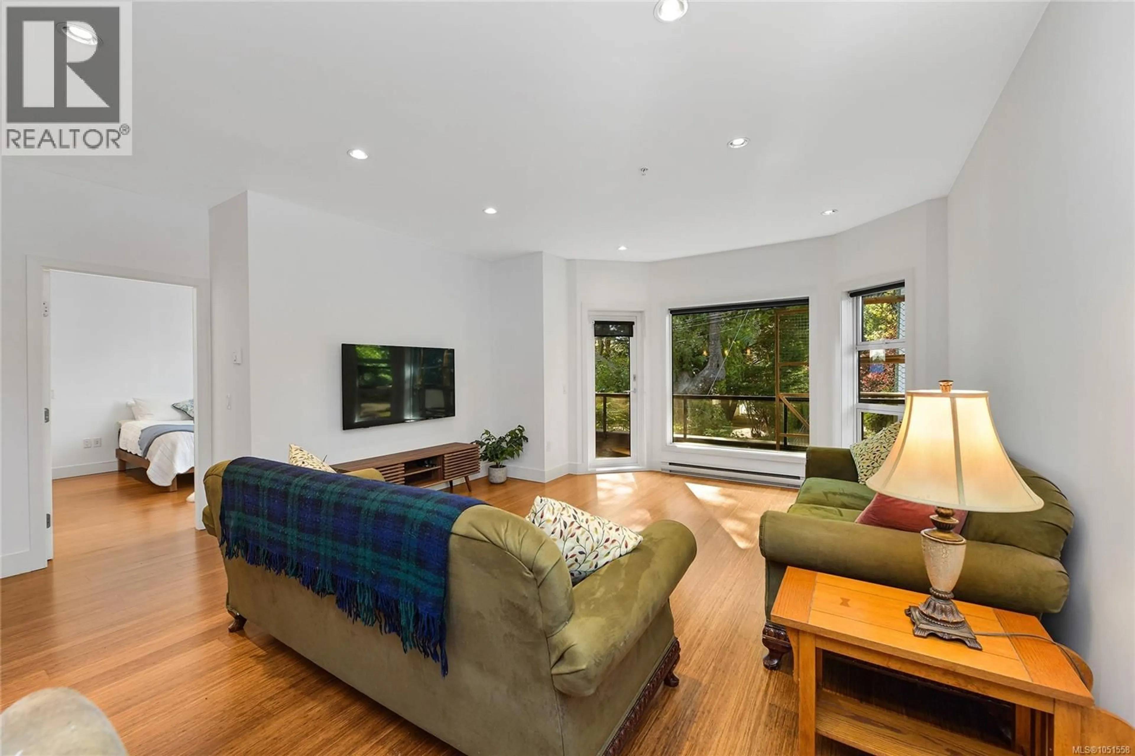Living room with furniture, unknown for 206 - 2589 PENRHYN STREET, Saanich British Columbia V8N1G4