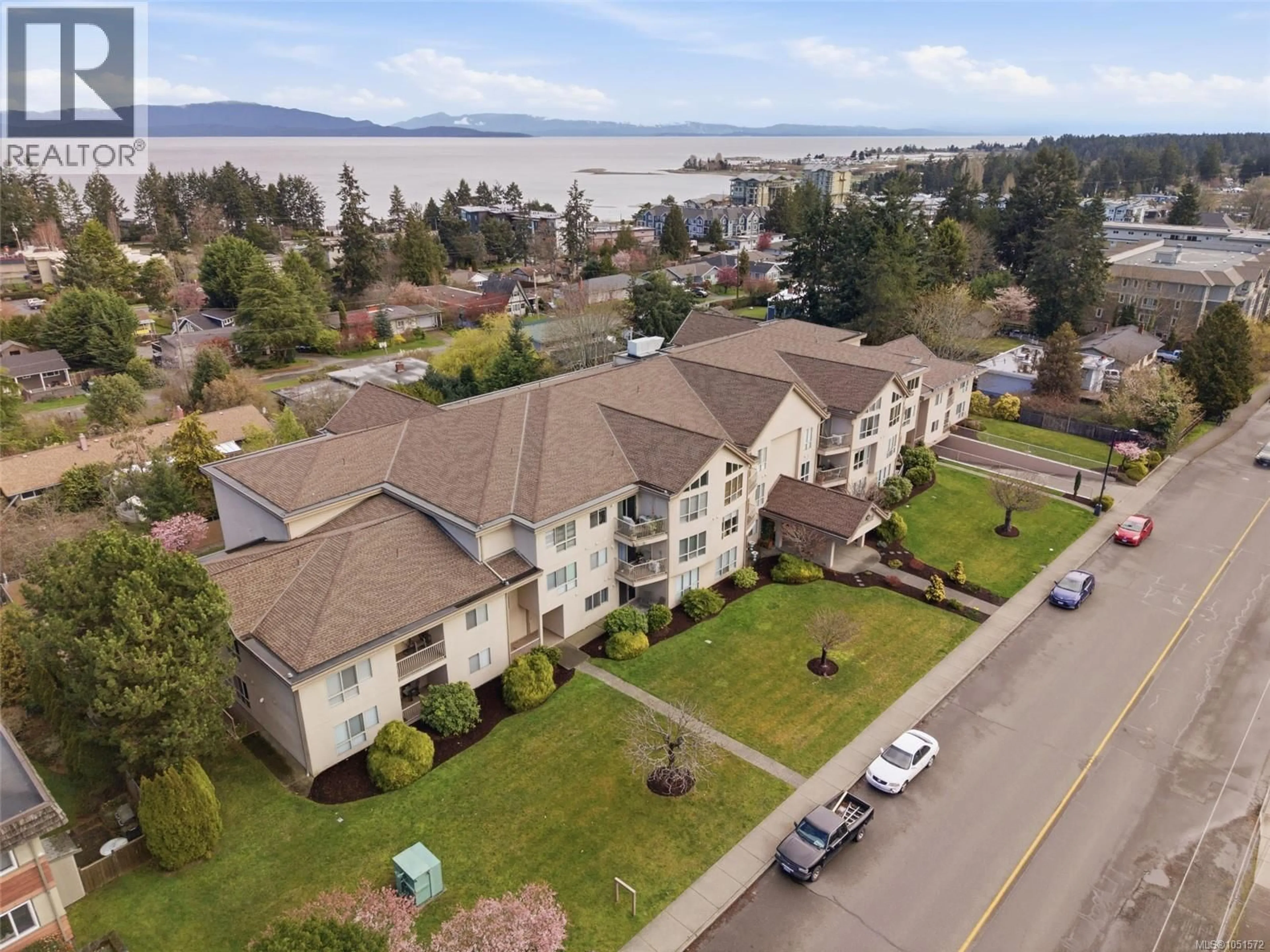 A pic from outside/outdoor area/front of a property/back of a property/a pic from drone, water/lake/river/ocean view for 106 - 335 HIRST AVENUE WEST, Parksville British Columbia V9P2R5