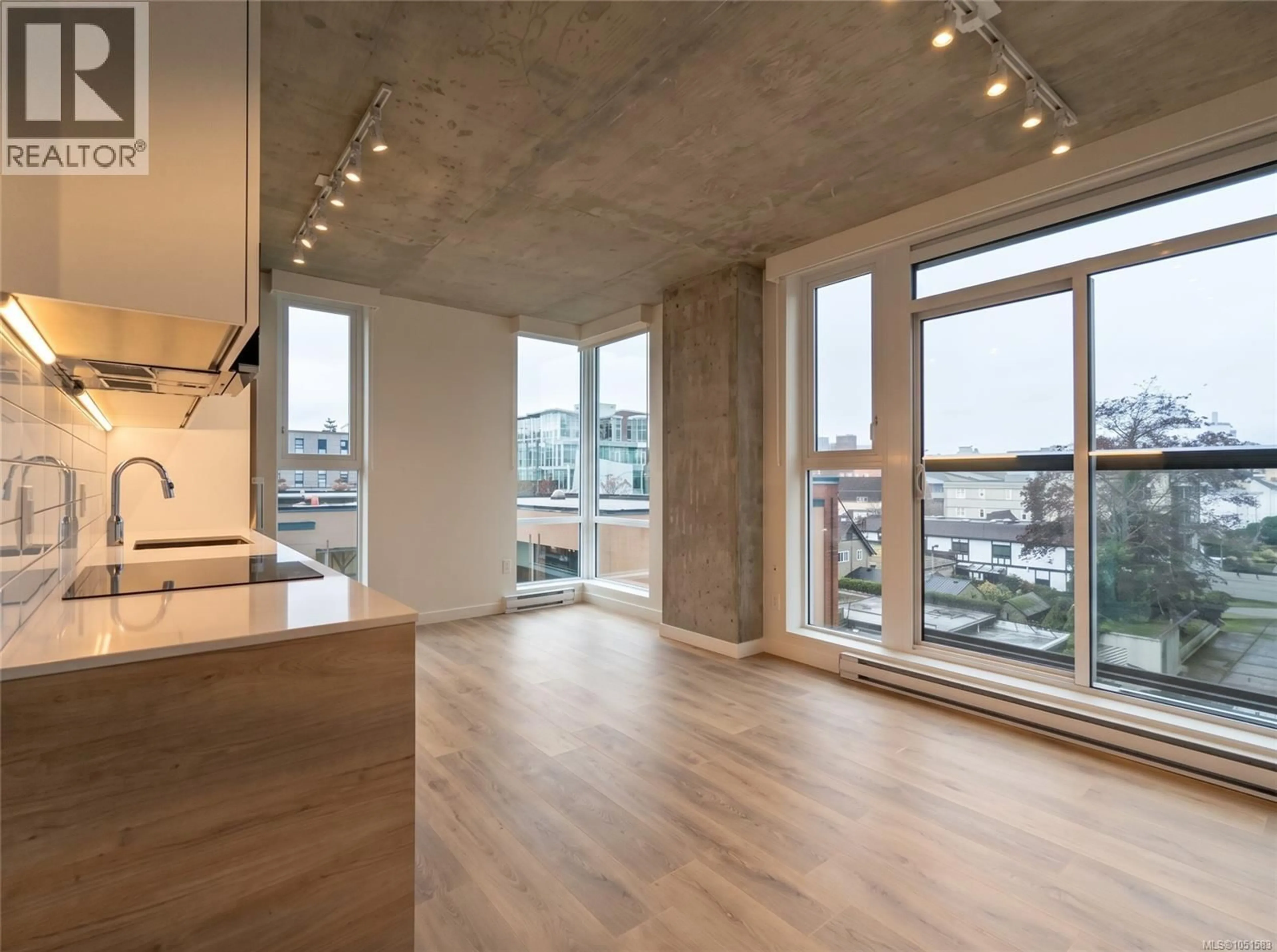 Open concept kitchen, cement floor for 409 - 1097 VIEW STREET, Victoria British Columbia V8V0G9