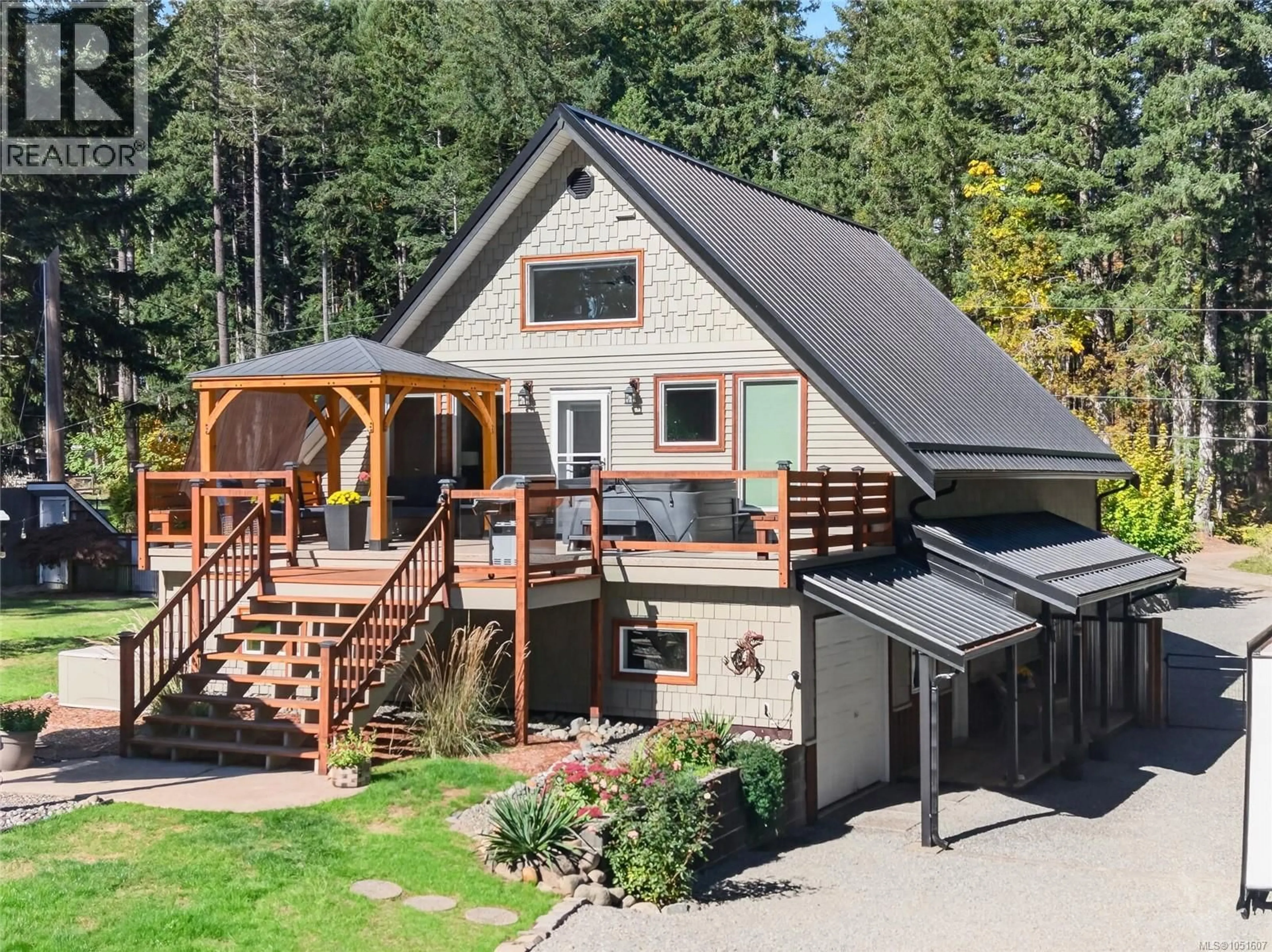 A pic from outside/outdoor area/front of a property/back of a property/a pic from drone, mountain view for 1981 DZINI ROAD, Black Creek British Columbia V9J1H1