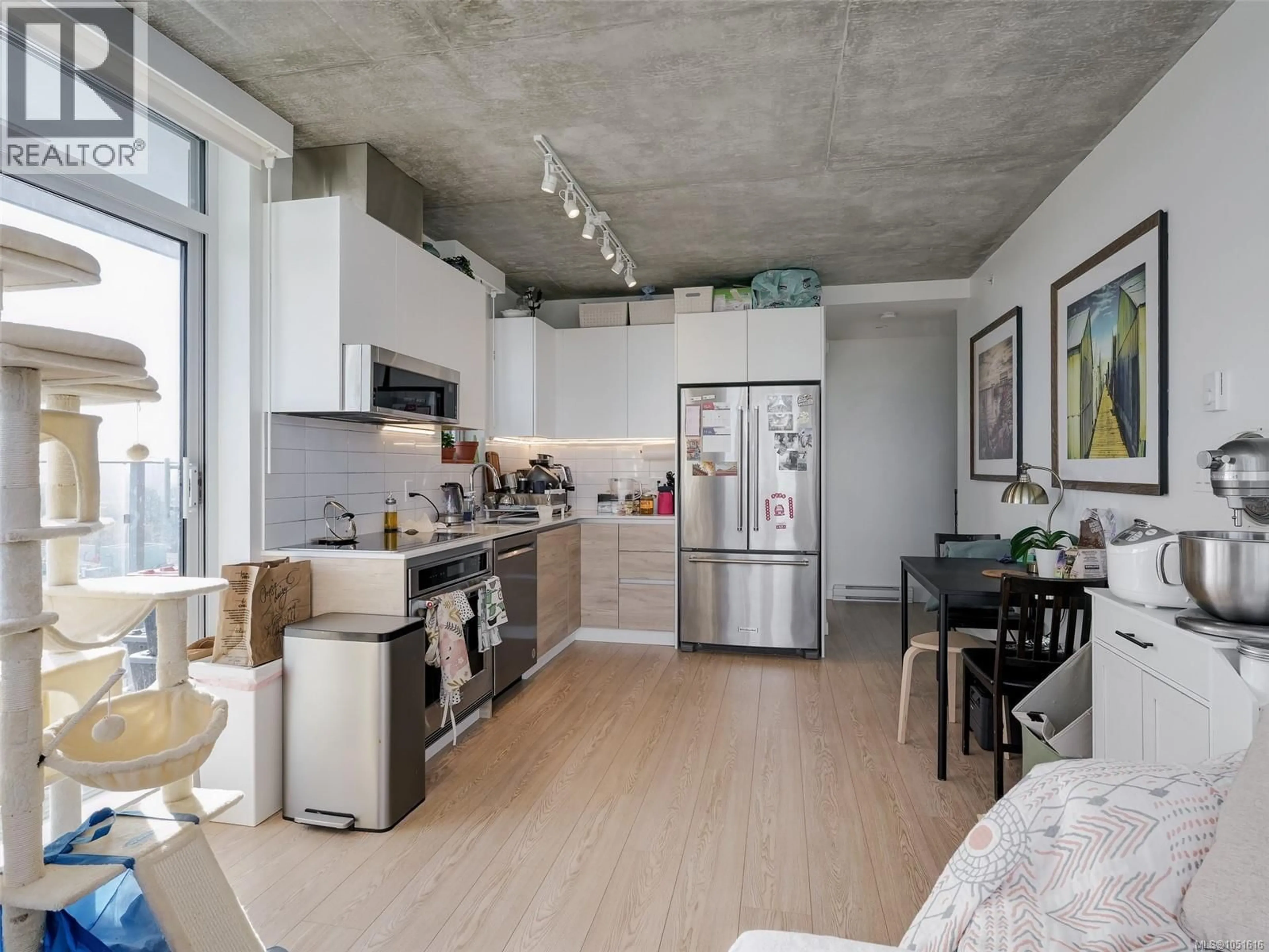 Open concept kitchen, cement floor for 1207 - 1097 VIEW STREET, Victoria British Columbia V8V0G9
