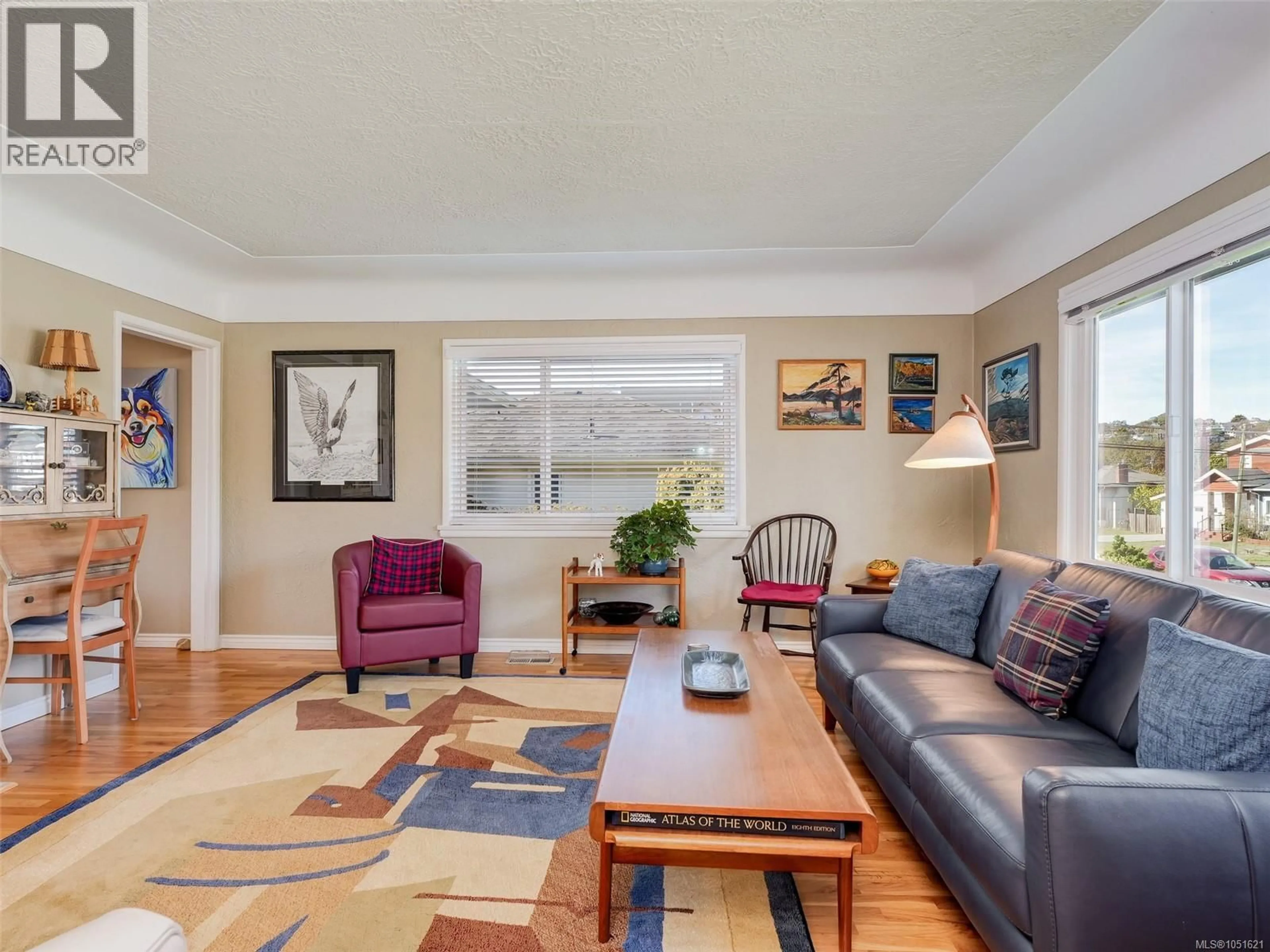 Living room with furniture, wood/laminate floor for 1715 CEDAR AVENUE, Saanich British Columbia V8P1X1