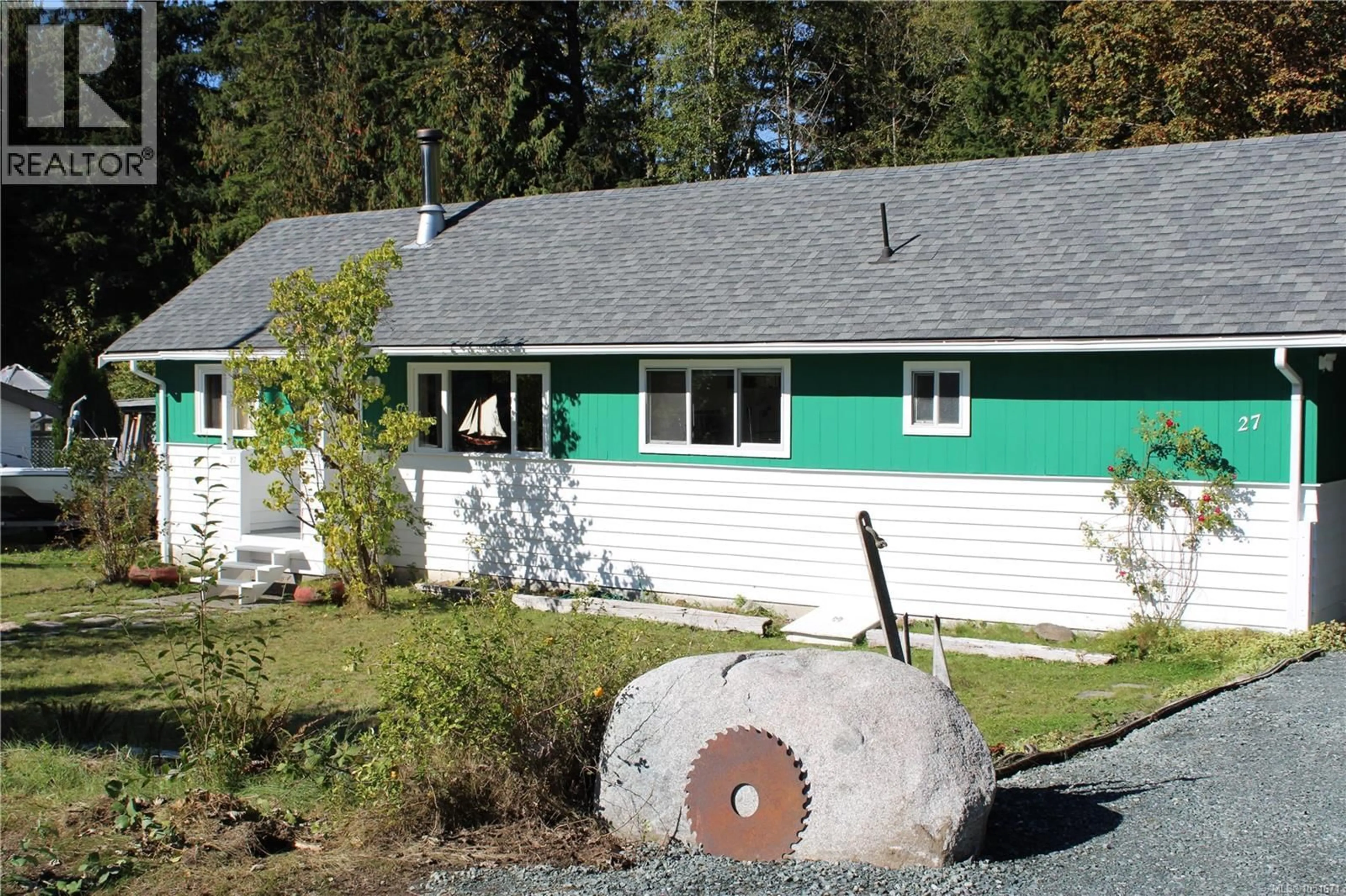 Home with vinyl exterior material, street for 27 CAIN DRIVE, Woss British Columbia V0N3P0