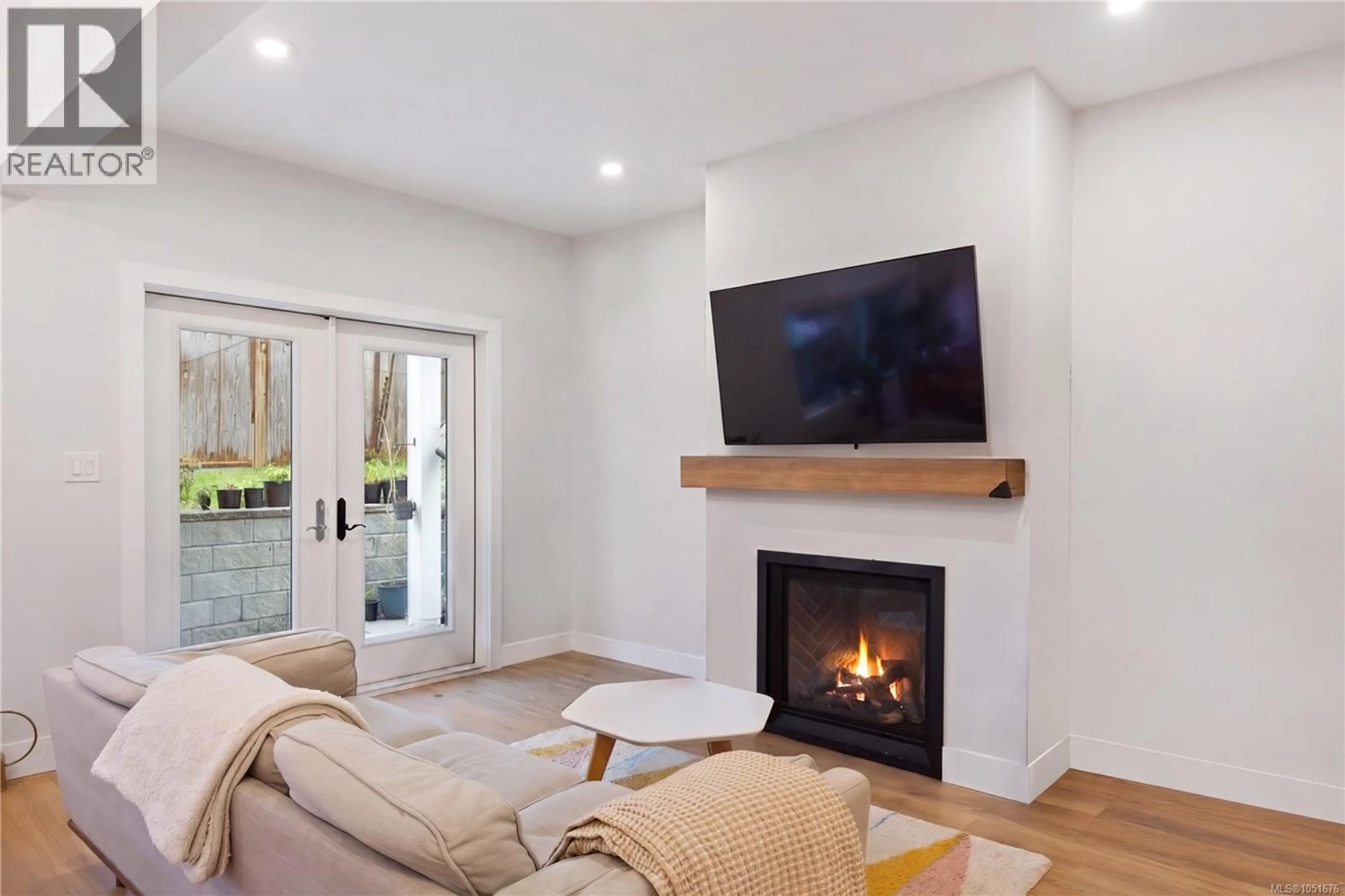 Living room with furniture, wood/laminate floor for 2153 BANFORD PLACE, Sooke British Columbia V9Z0W6