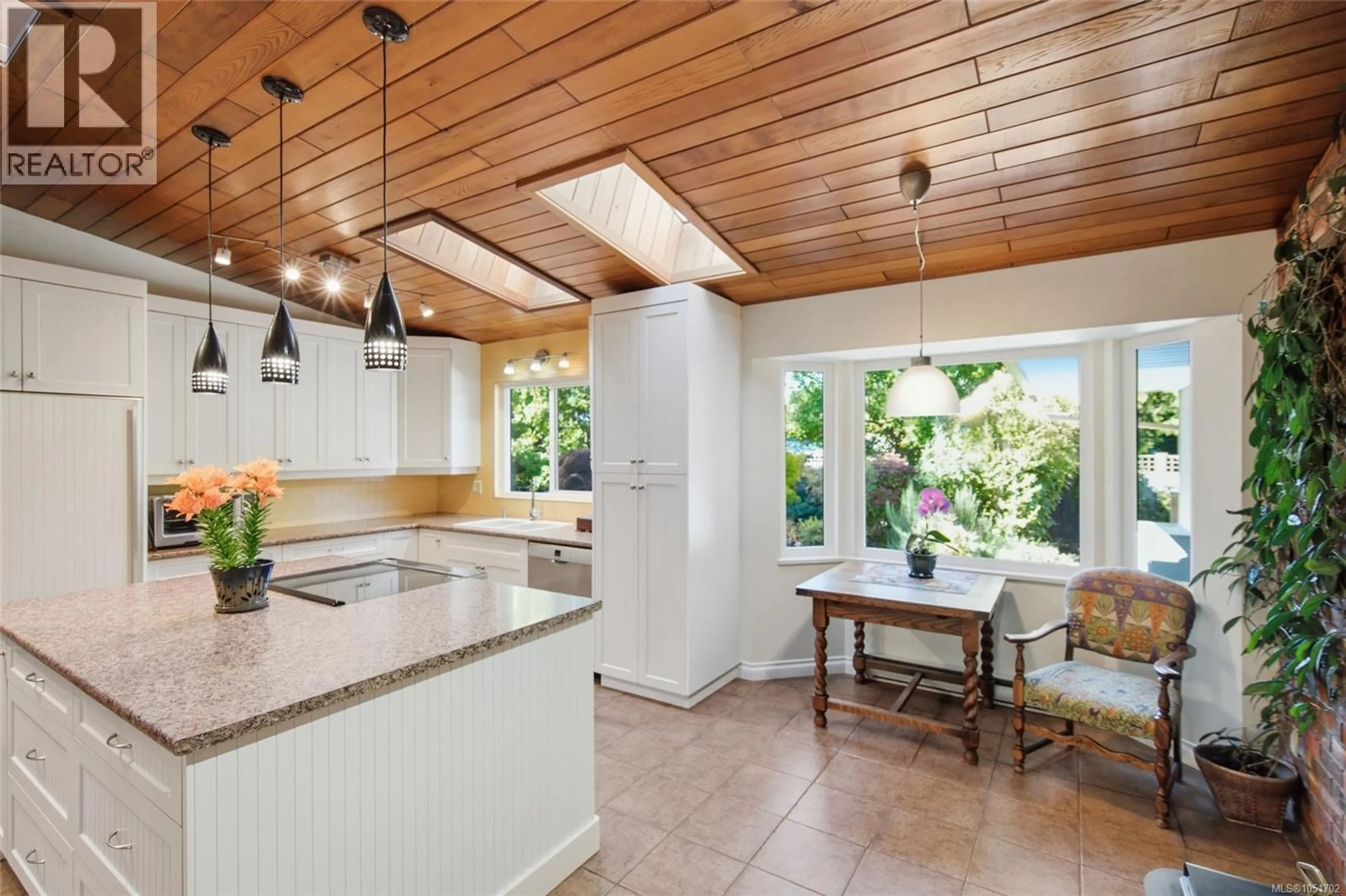Open concept kitchen, ceramic/tile floor for 1061 HARLEQUIN ROAD, Qualicum Beach British Columbia V9K1E2