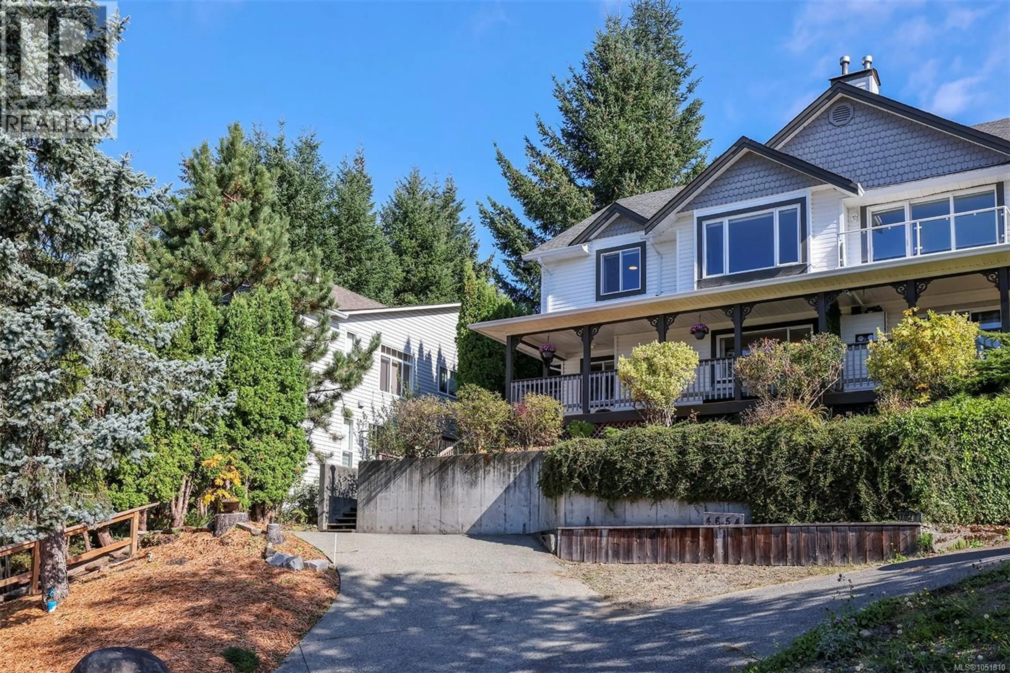 Home with vinyl exterior material, street for A - 4654 CRUICKSHANK AVENUE, Courtenay British Columbia V9N7W6