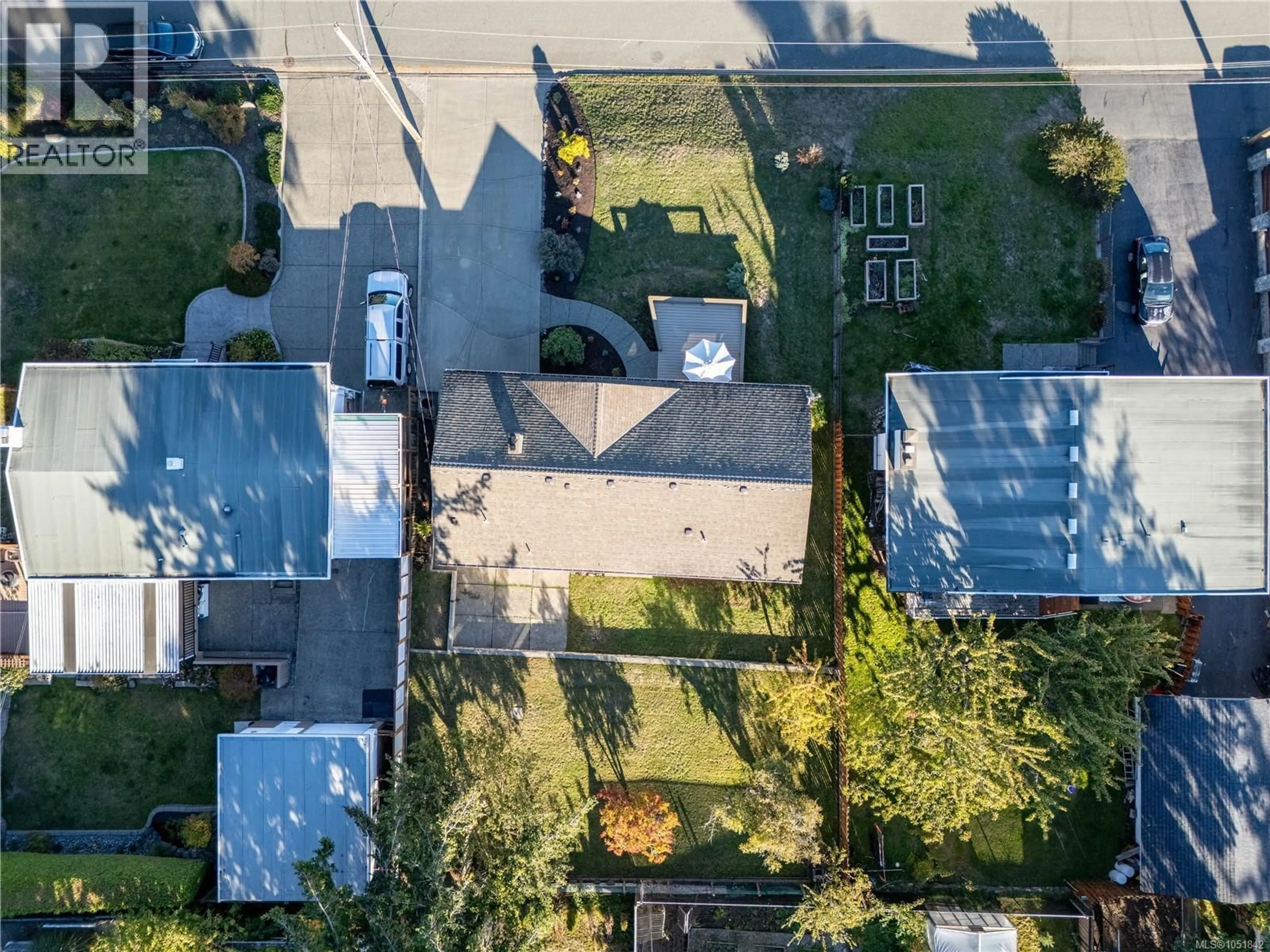 A pic from outside/outdoor area/front of a property/back of a property/a pic from drone, street for 766 NANCY GREENE DRIVE, Campbell River British Columbia V9W2A6