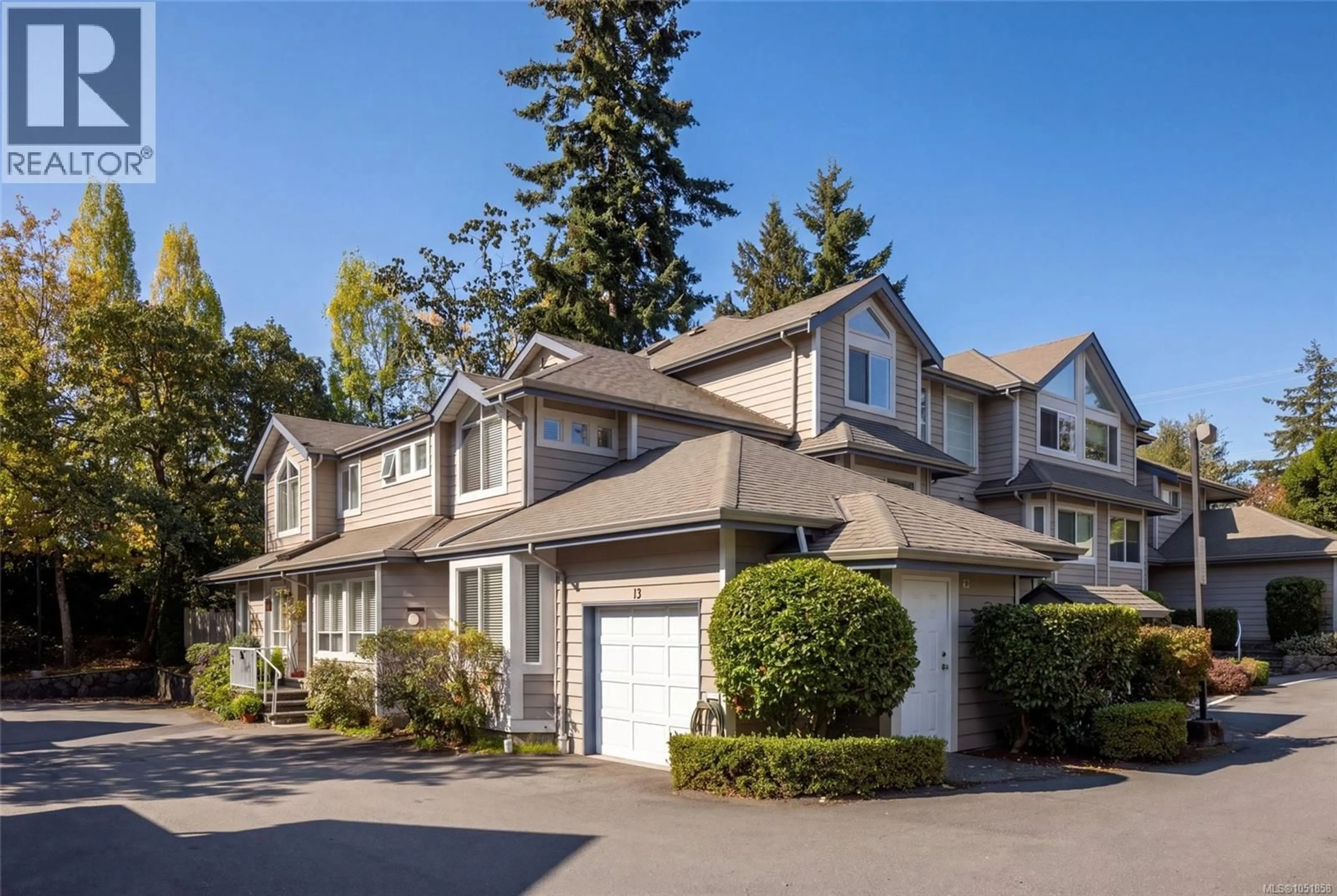 Home with vinyl exterior material, street for 13 - 4619 ELK LAKE DRIVE, Saanich British Columbia V8Z5M2