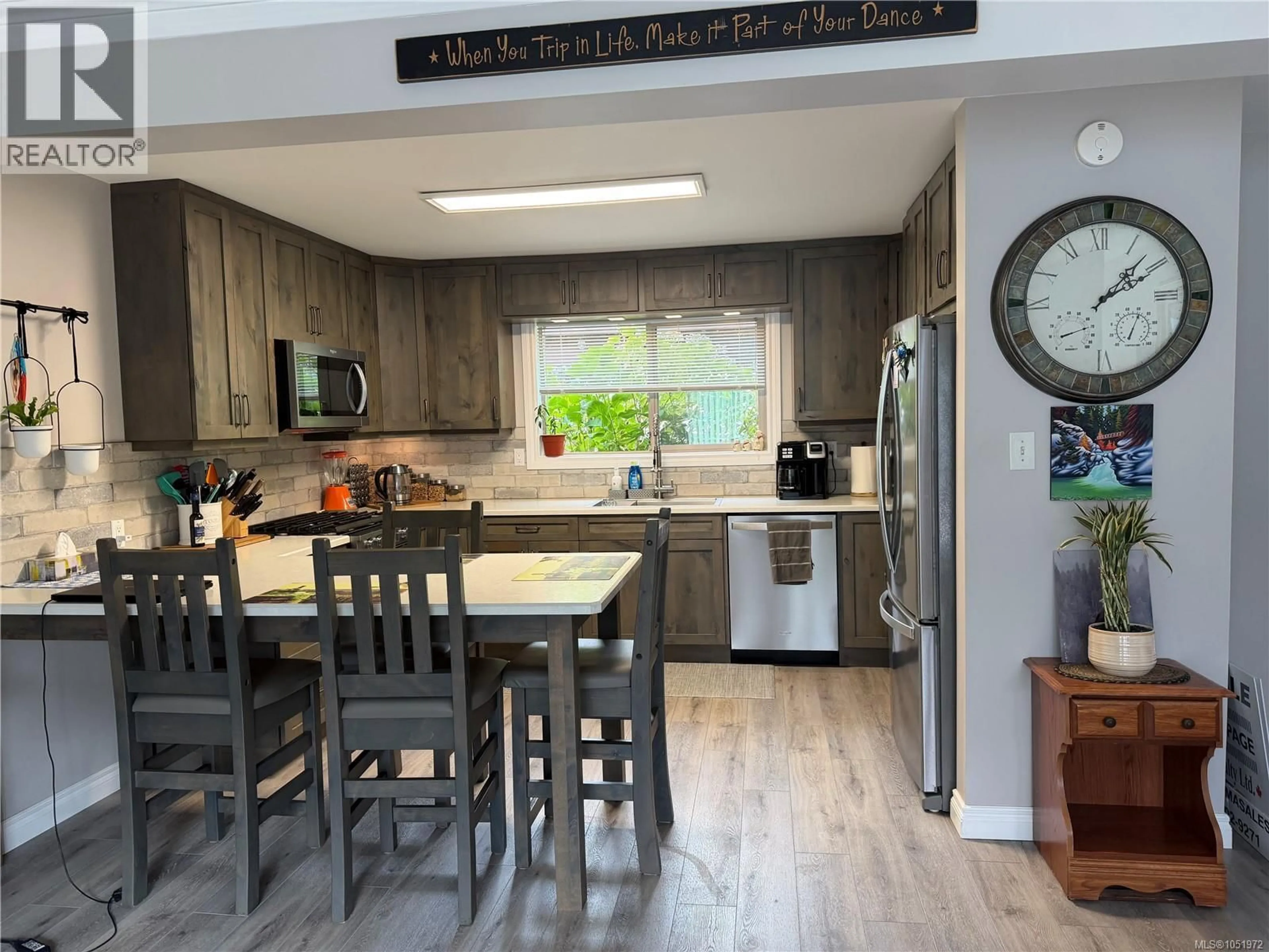 Open concept kitchen, wood/laminate floor for 202 HAIDA AVENUE, Port Alice British Columbia V0N2N0