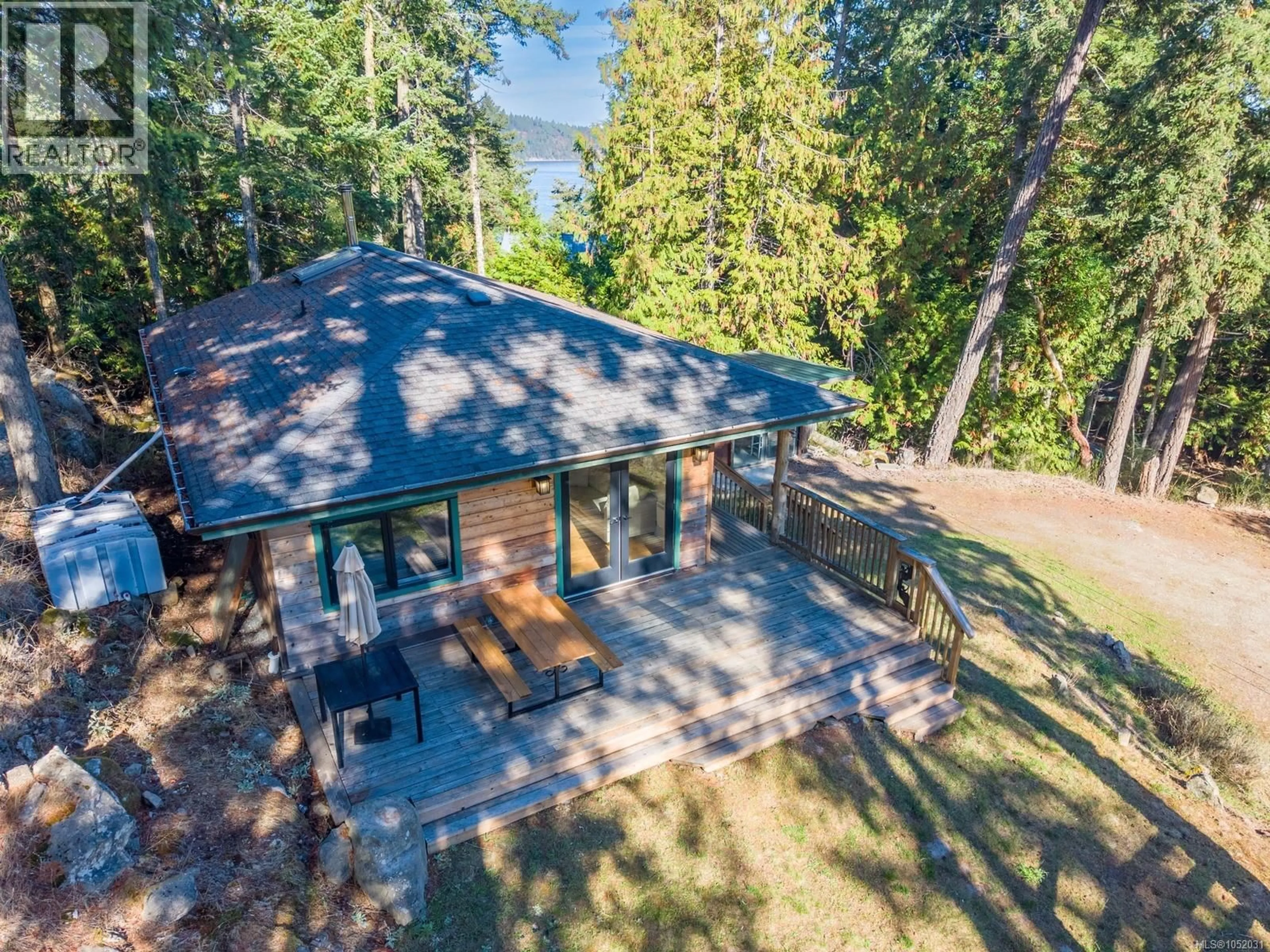 A pic from outside/outdoor area/front of a property/back of a property/a pic from drone, forest/trees view for 4318 PORT WASHINGTON ROAD, Pender Island British Columbia V0N2M1