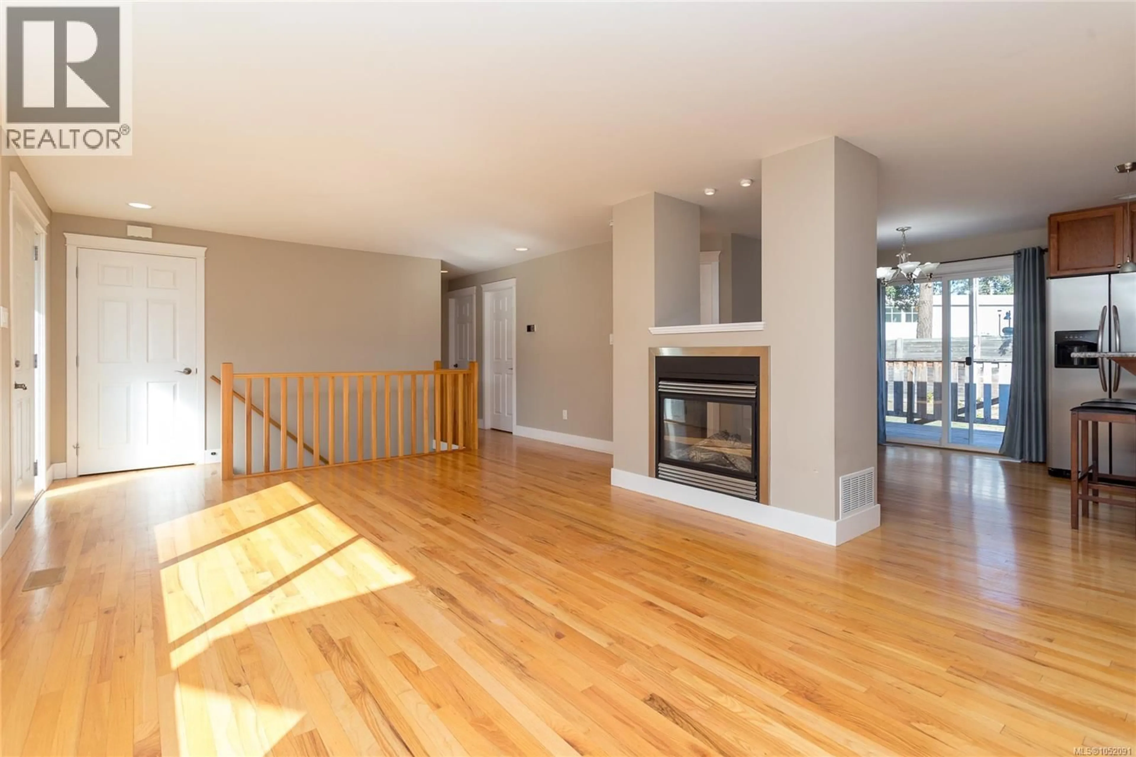 Living room with furniture, wood/laminate floor for 590 RIDLEY DRIVE, Colwood British Columbia V9C1K4