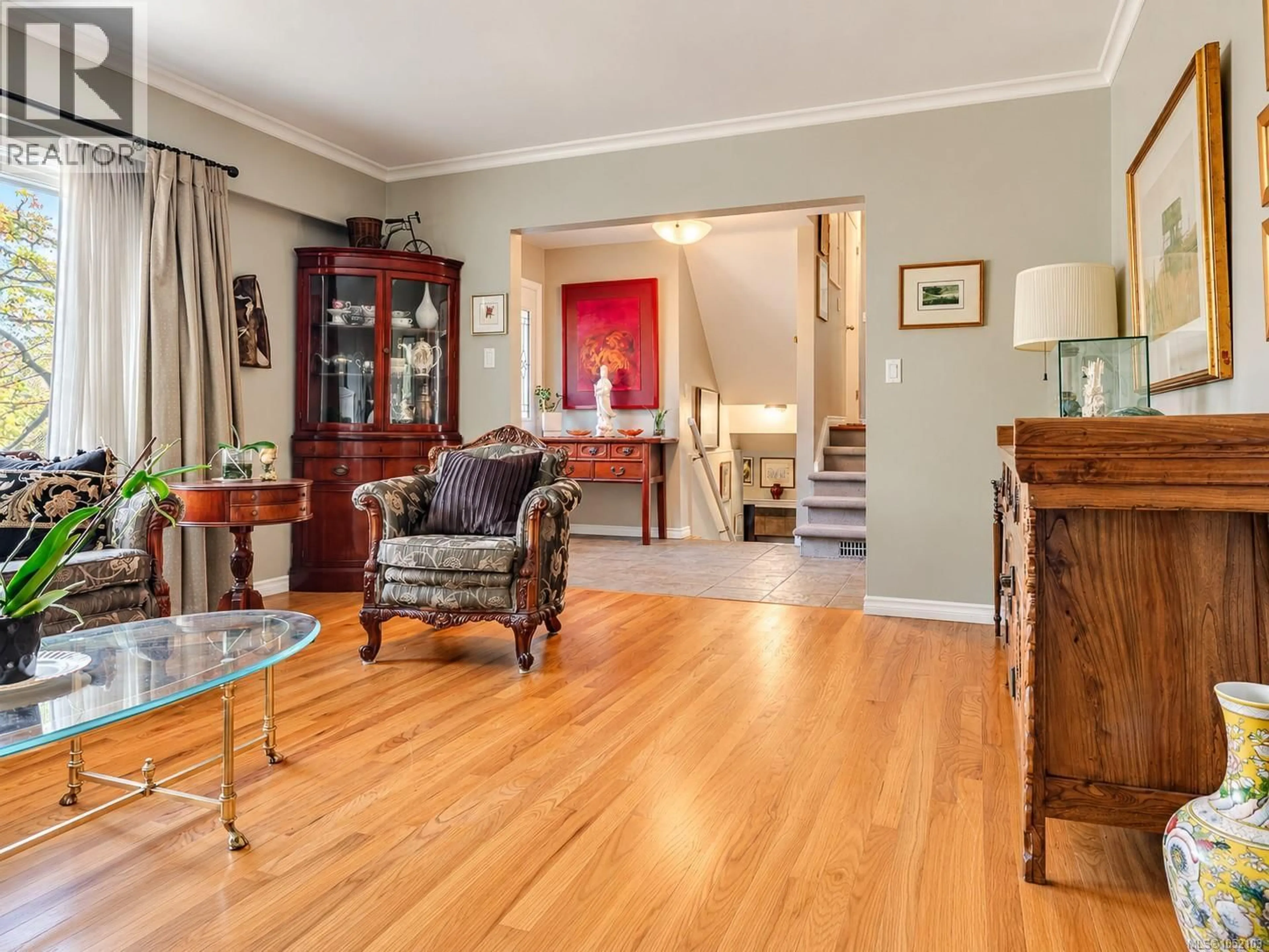 Living room with furniture, wood/laminate floor for 3524 PLYMOUTH ROAD, Oak Bay British Columbia V8P4X4