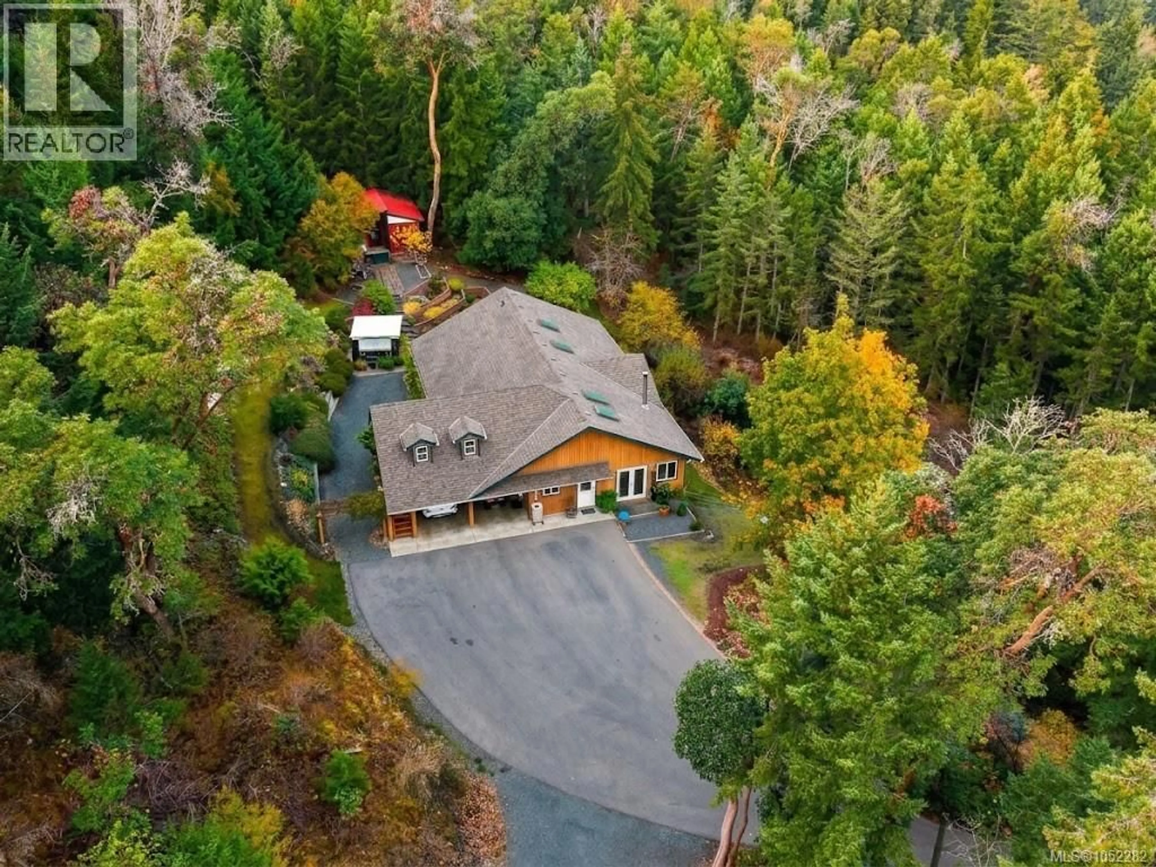 A pic from outside/outdoor area/front of a property/back of a property/a pic from drone, forest/trees view for 1990 RENA ROAD, Nanoose Bay British Columbia V9P9B1